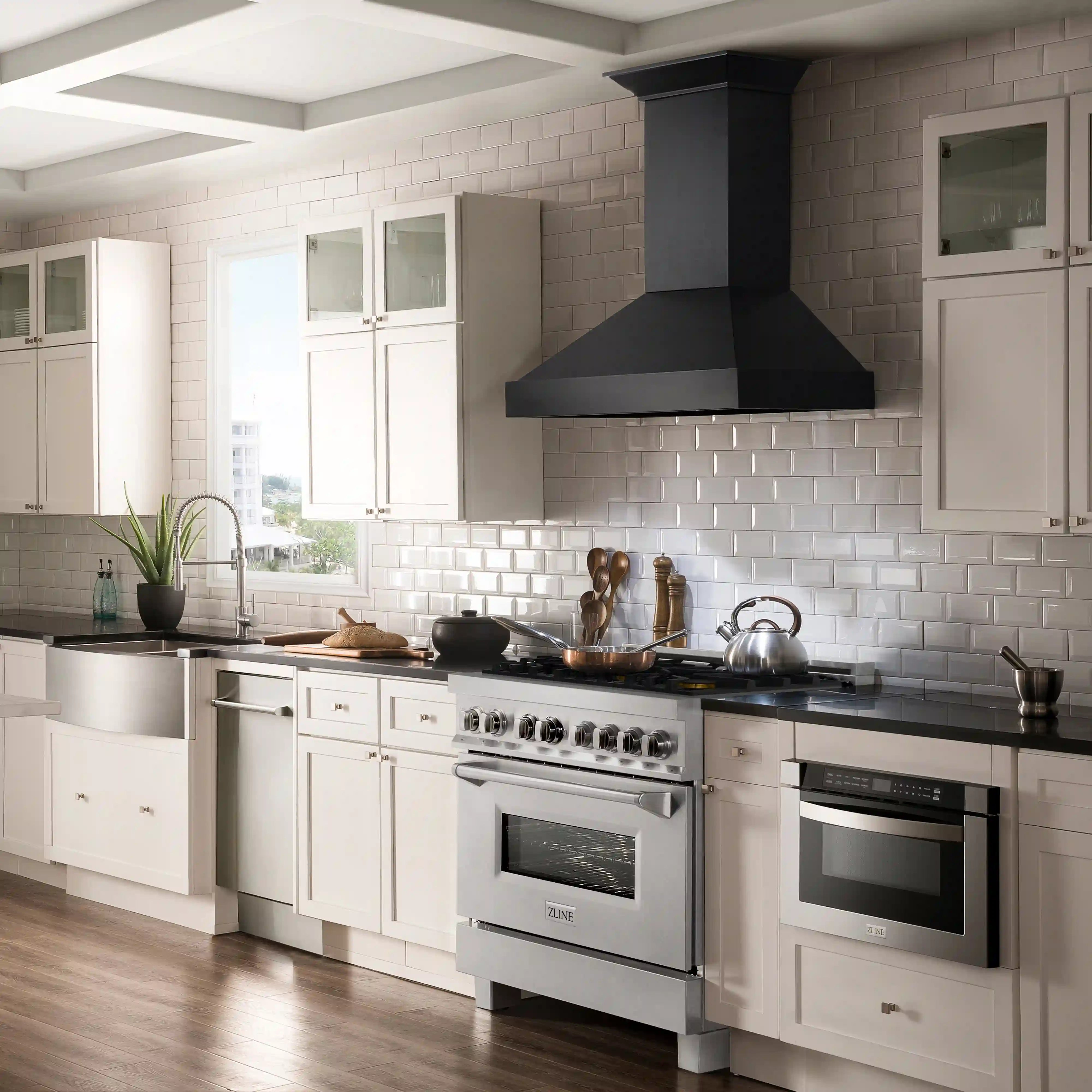 Stainless steel dual fuel range with burner knobs and oven door in kitchen