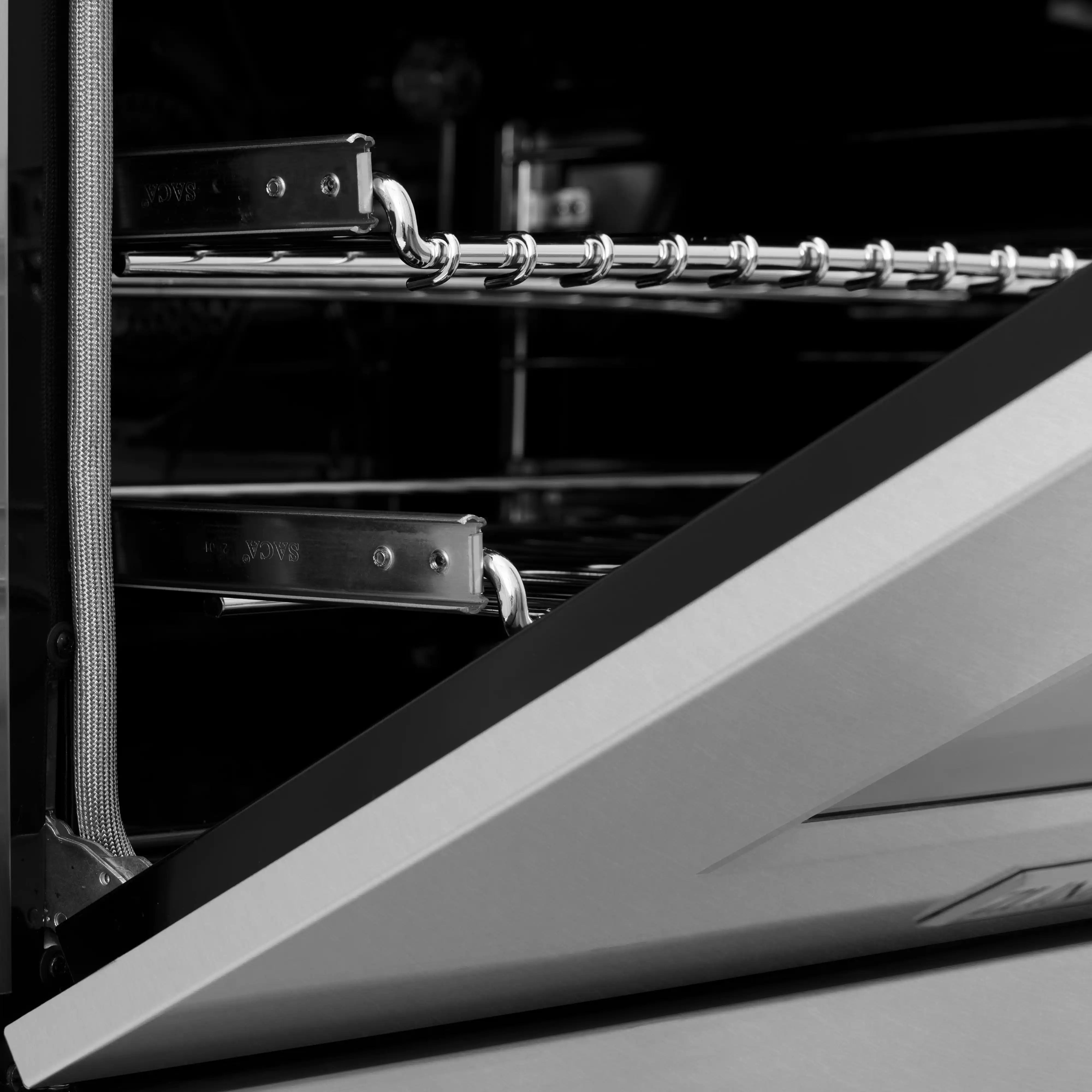 Open oven interior with metal racks and back heating element inside stainless range