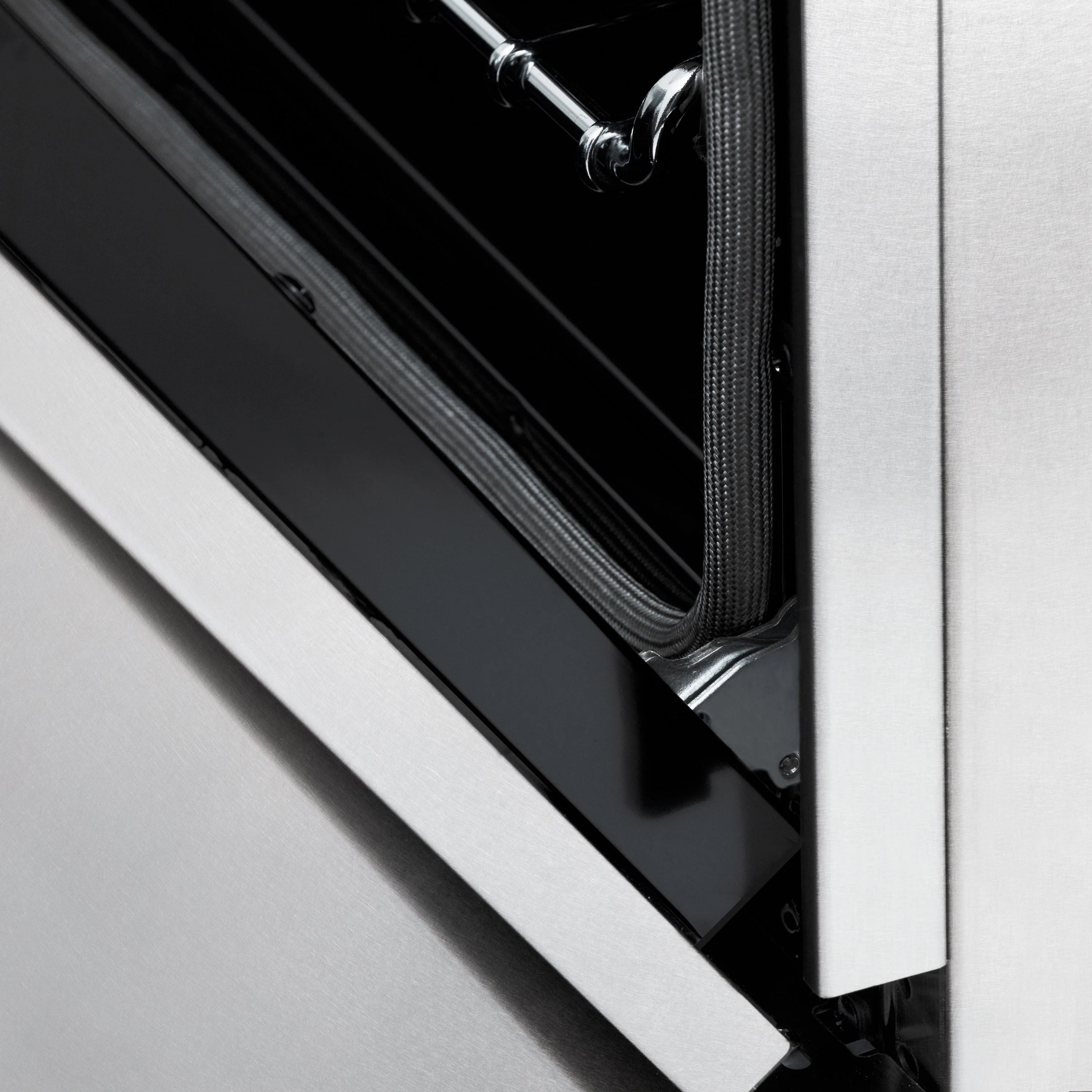 Range oven door seal and side frame with chrome handle bars.