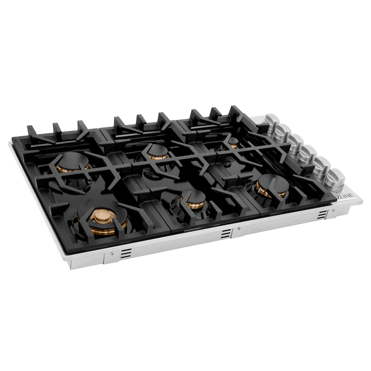 Gas cooktop angled view with black grates, six brass burners, and stainless base