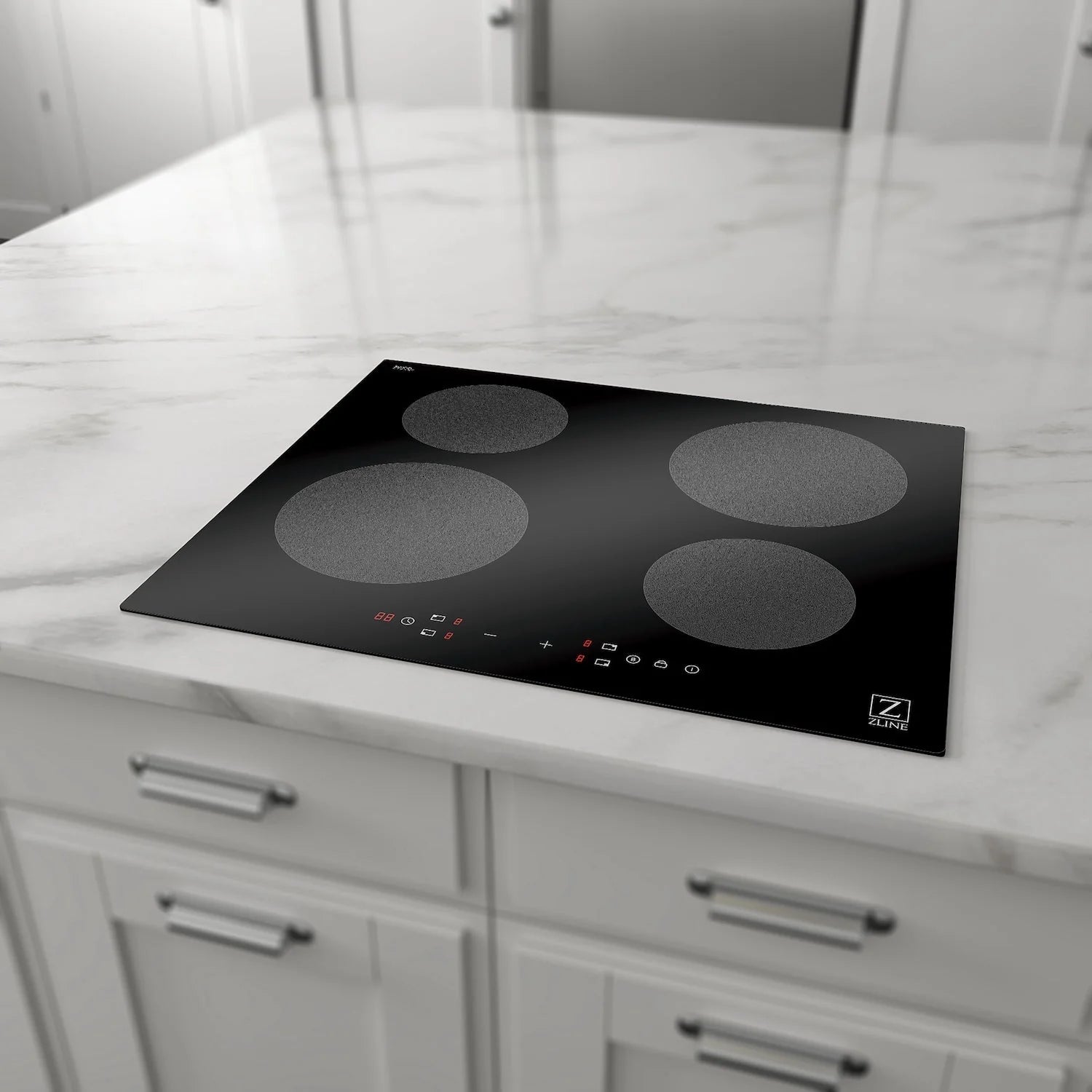 Black glass 4-burner induction cooktop on a kitchen countertop with four zones