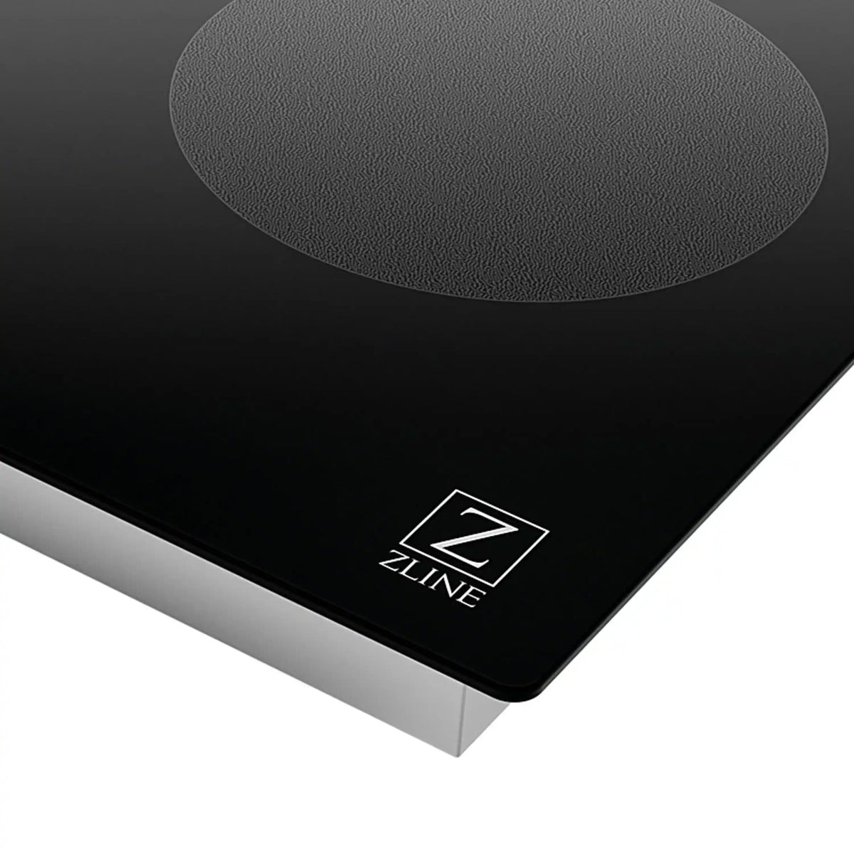 ZLINE induction cooktop corner with ZLINE logo on black glass surface