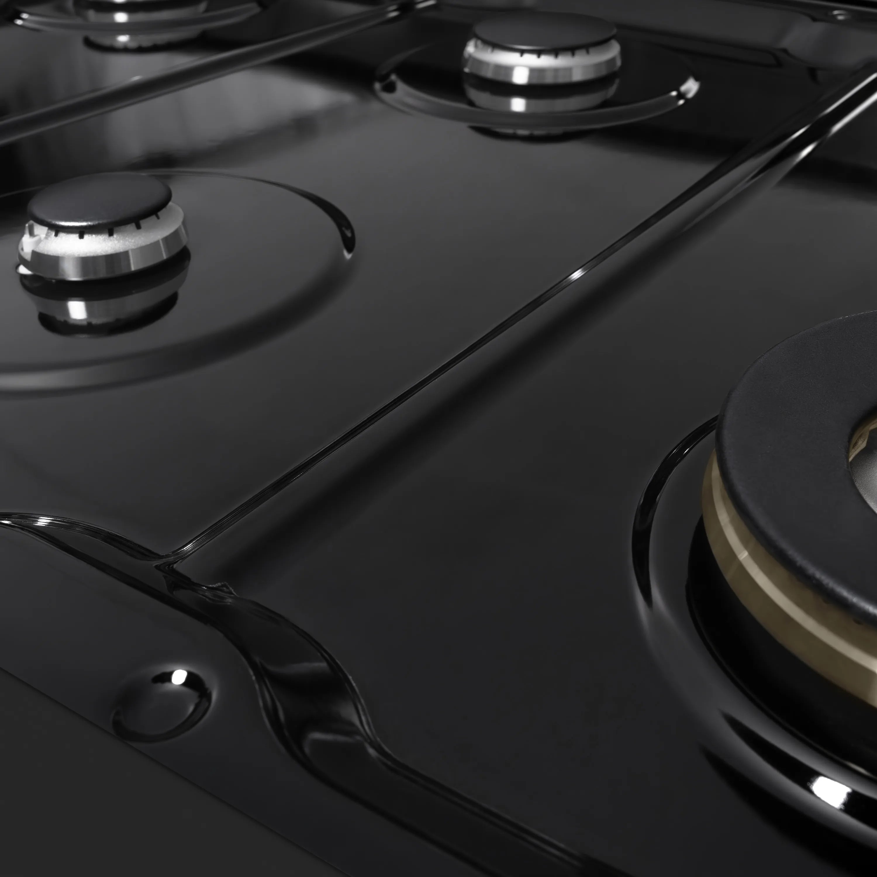 Black gas cooktop burner knobs and grates on ZLINE double oven range