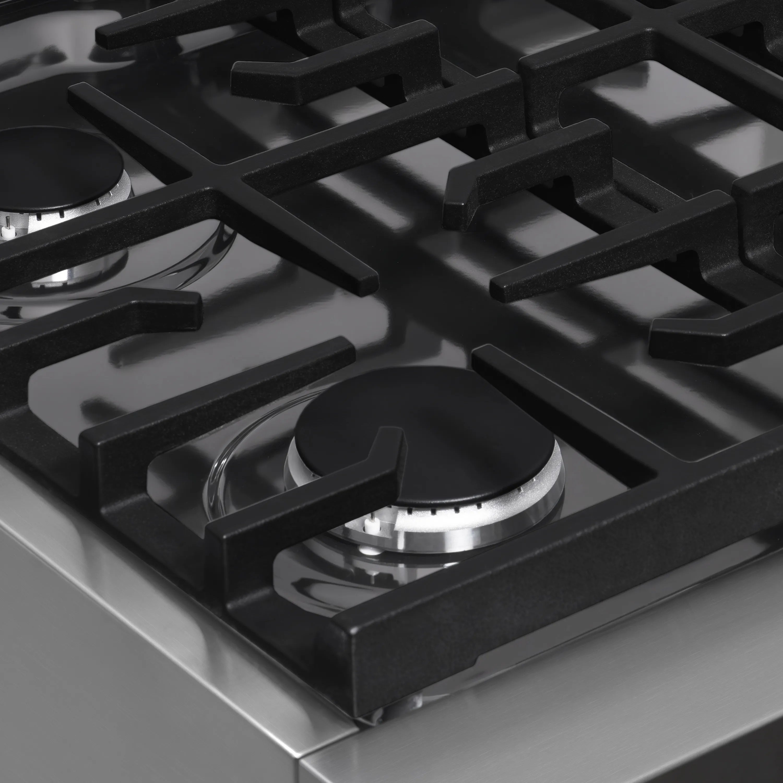 Gas cooktop burner grate with single control area on stainless steel range