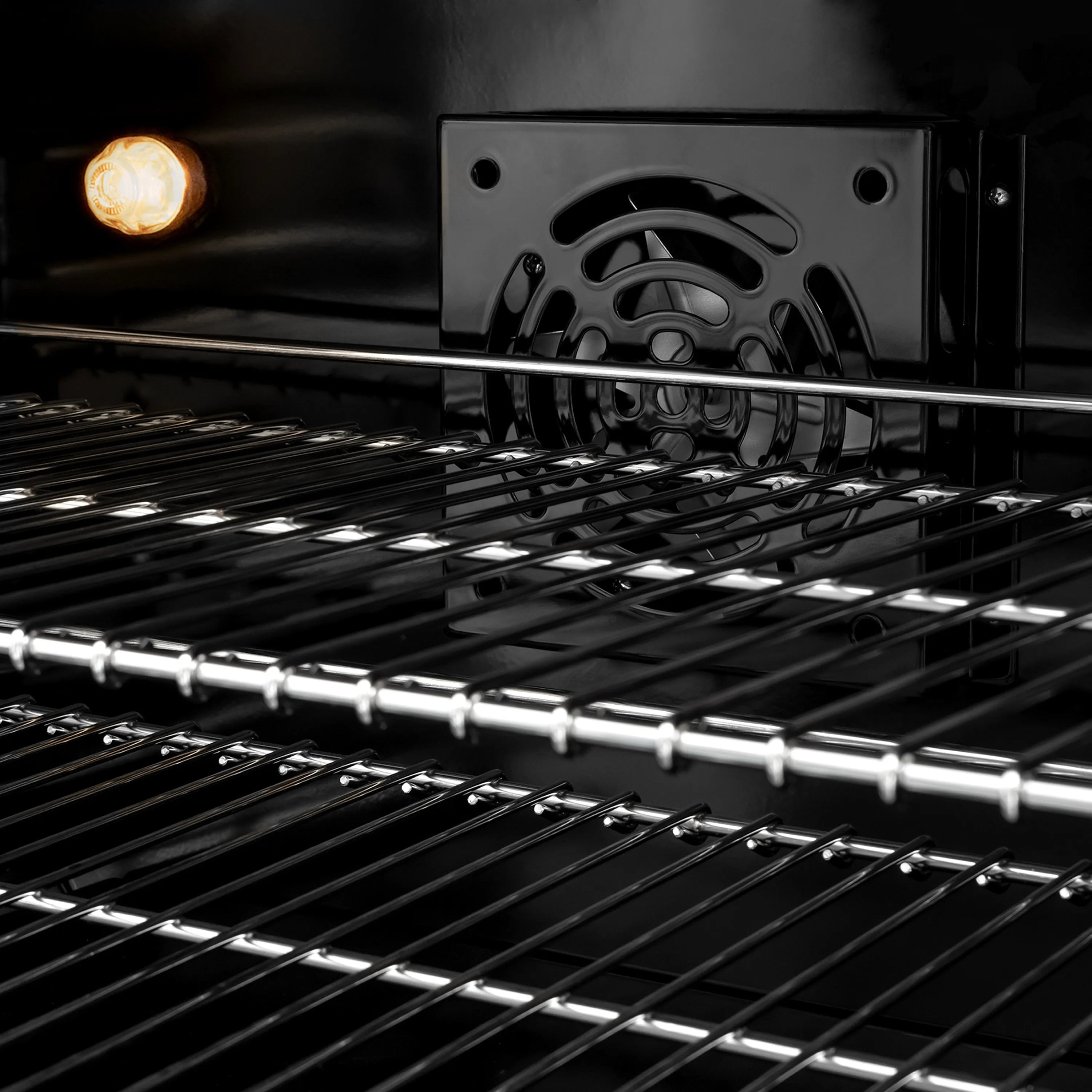 Stainless steel gas range grates with visible burner flame