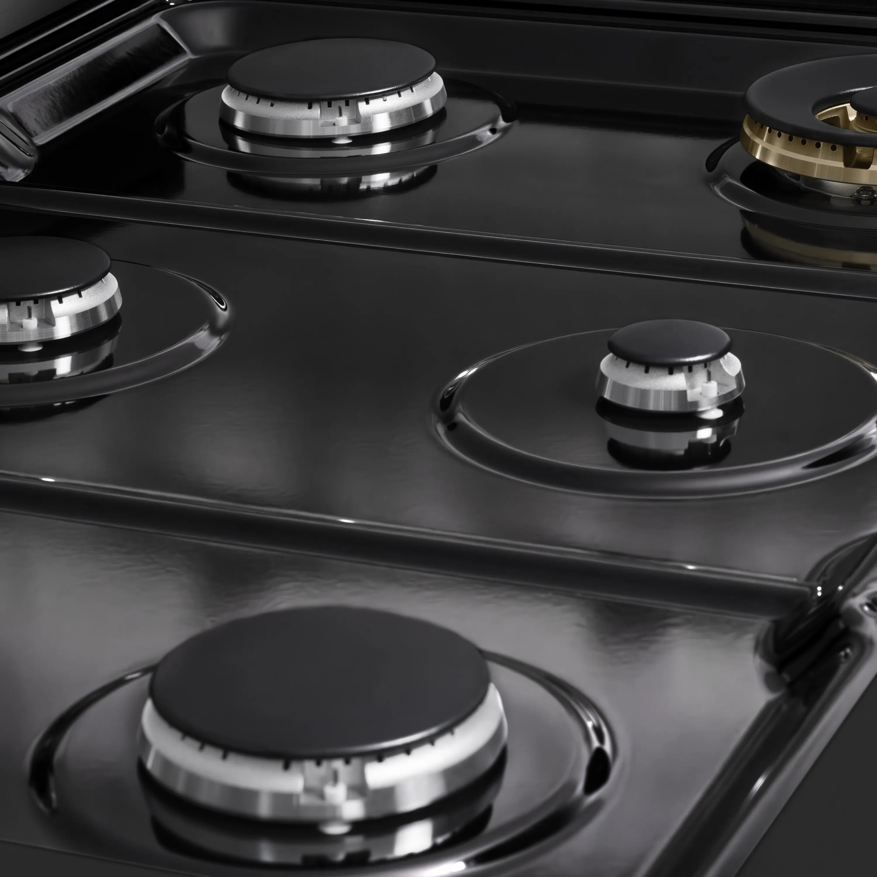 ZLINE black gas cooktop with four burners and black burner caps on stainless surface.