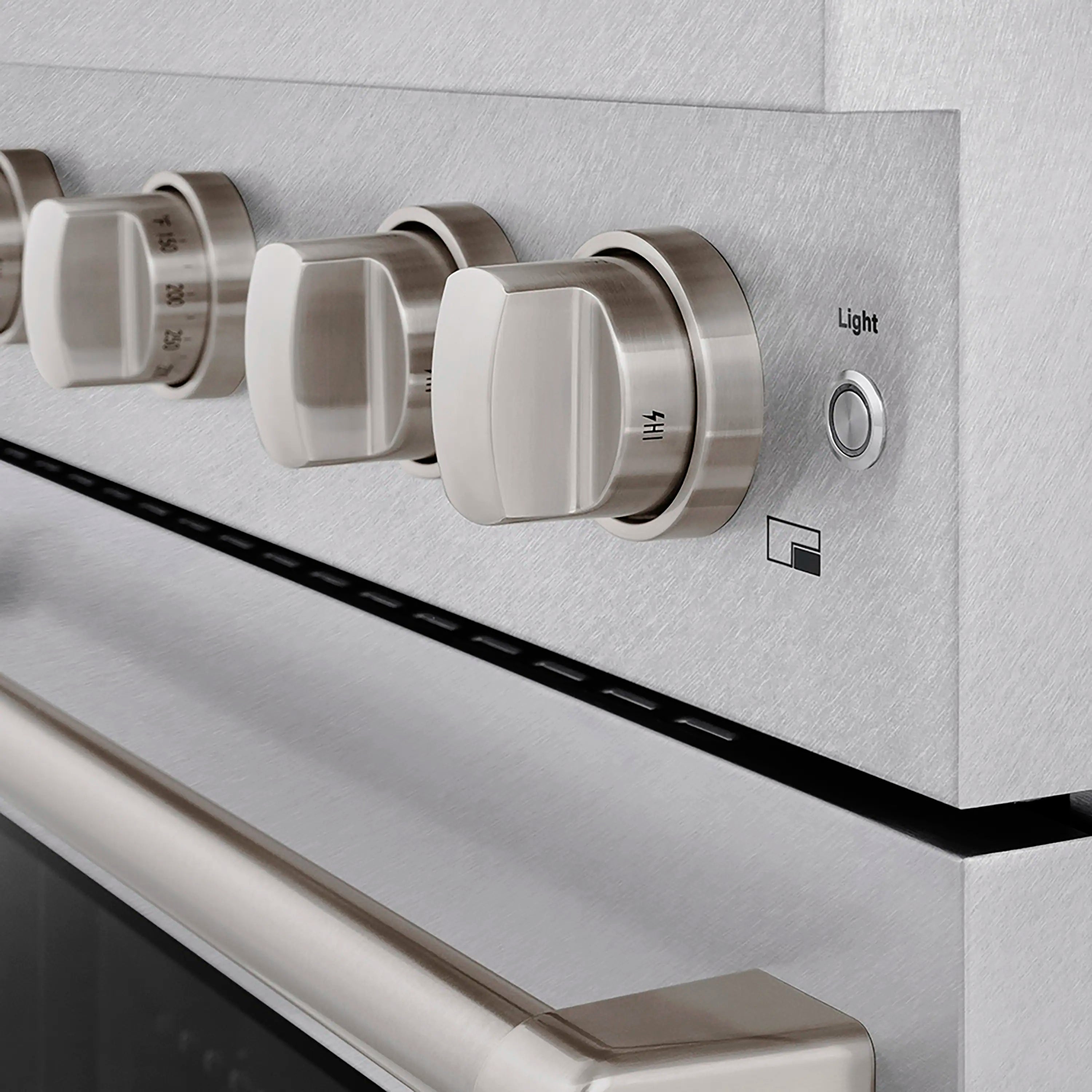 Stainless steel cooktop control knobs with Light button and indicator icons on a range