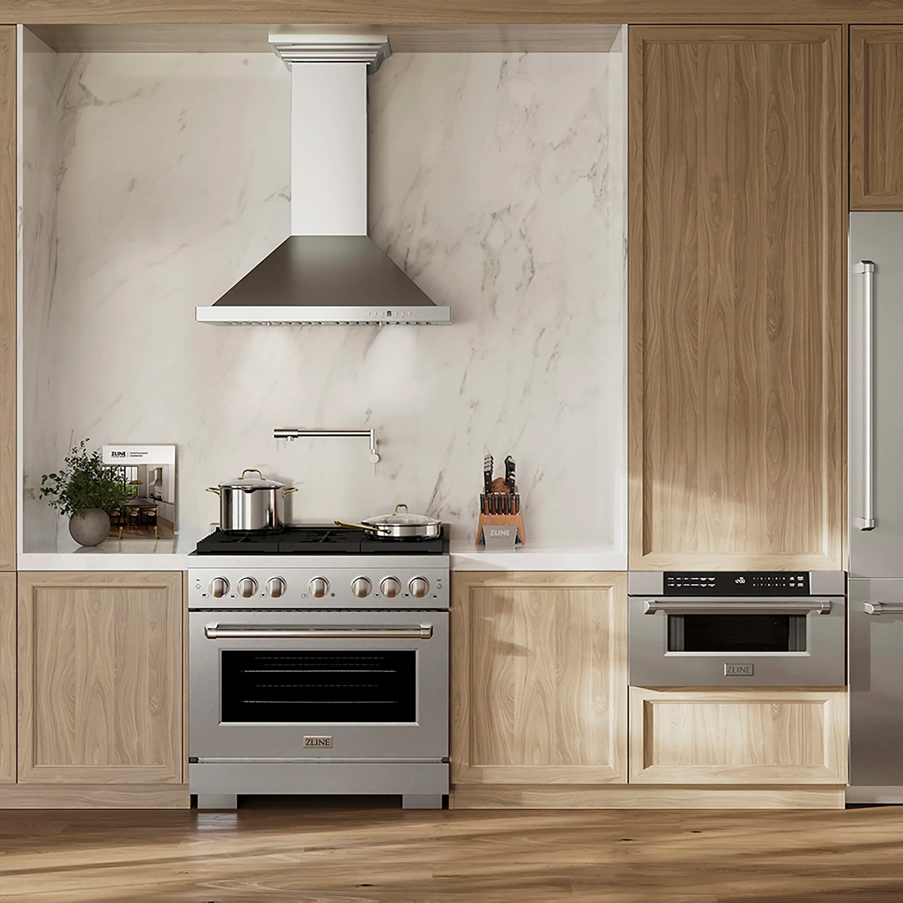 Satin stainless steel dual-fuel range installed in a light wood kitchen
