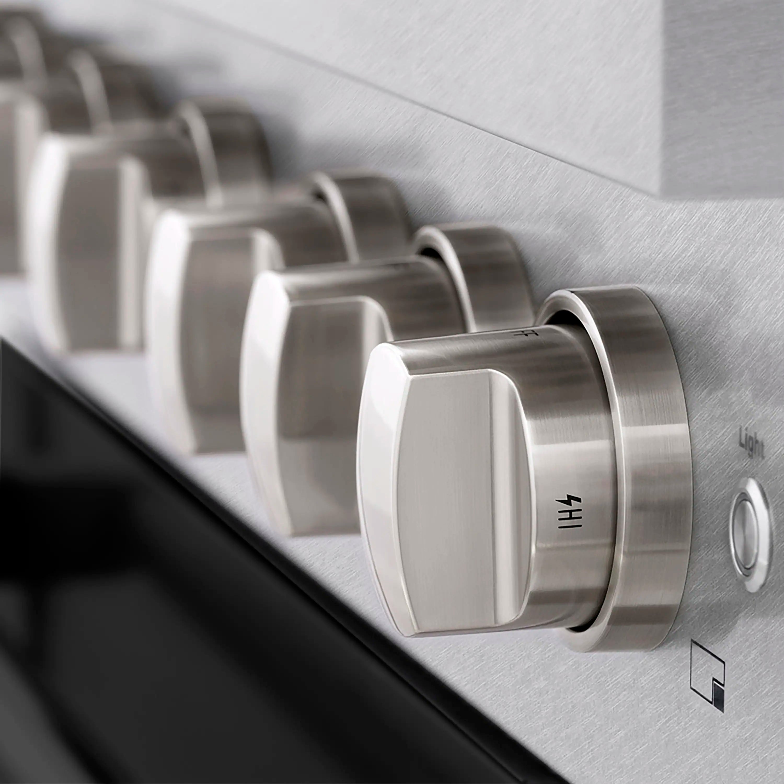 Dual fuel range control dial and stainless control panel with engraved markings