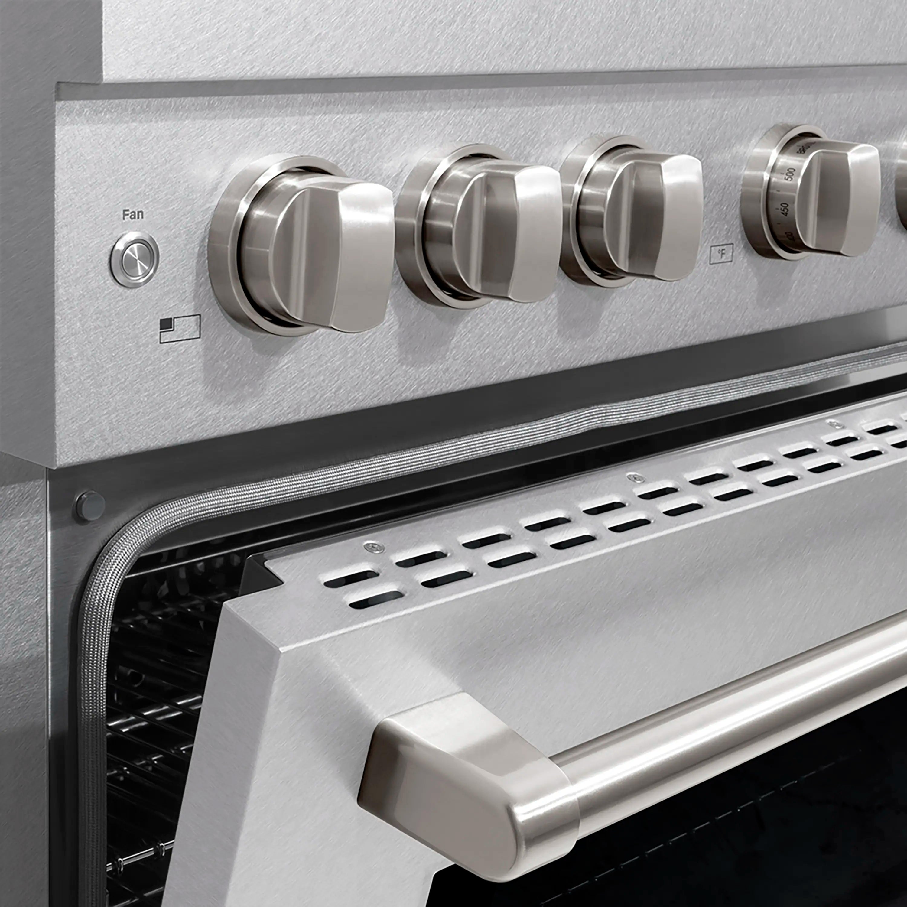 Stainless steel oven control knobs above the oven vent and handle area.