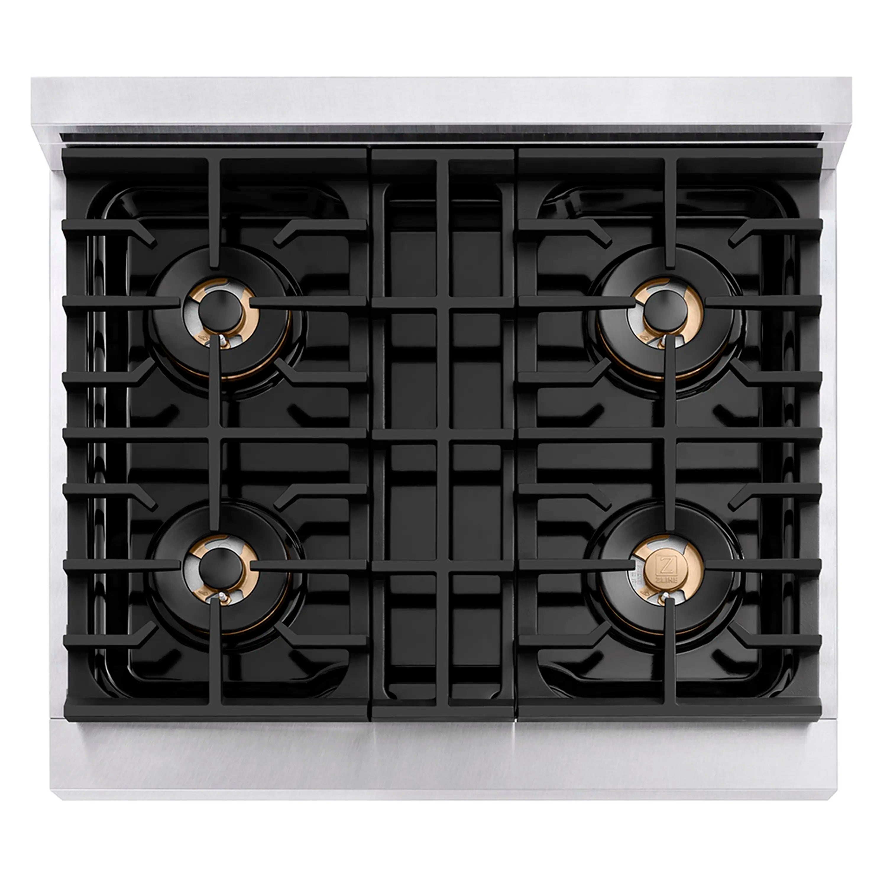 Four-burner gas cooktop with black grates and polished gold ring accents
