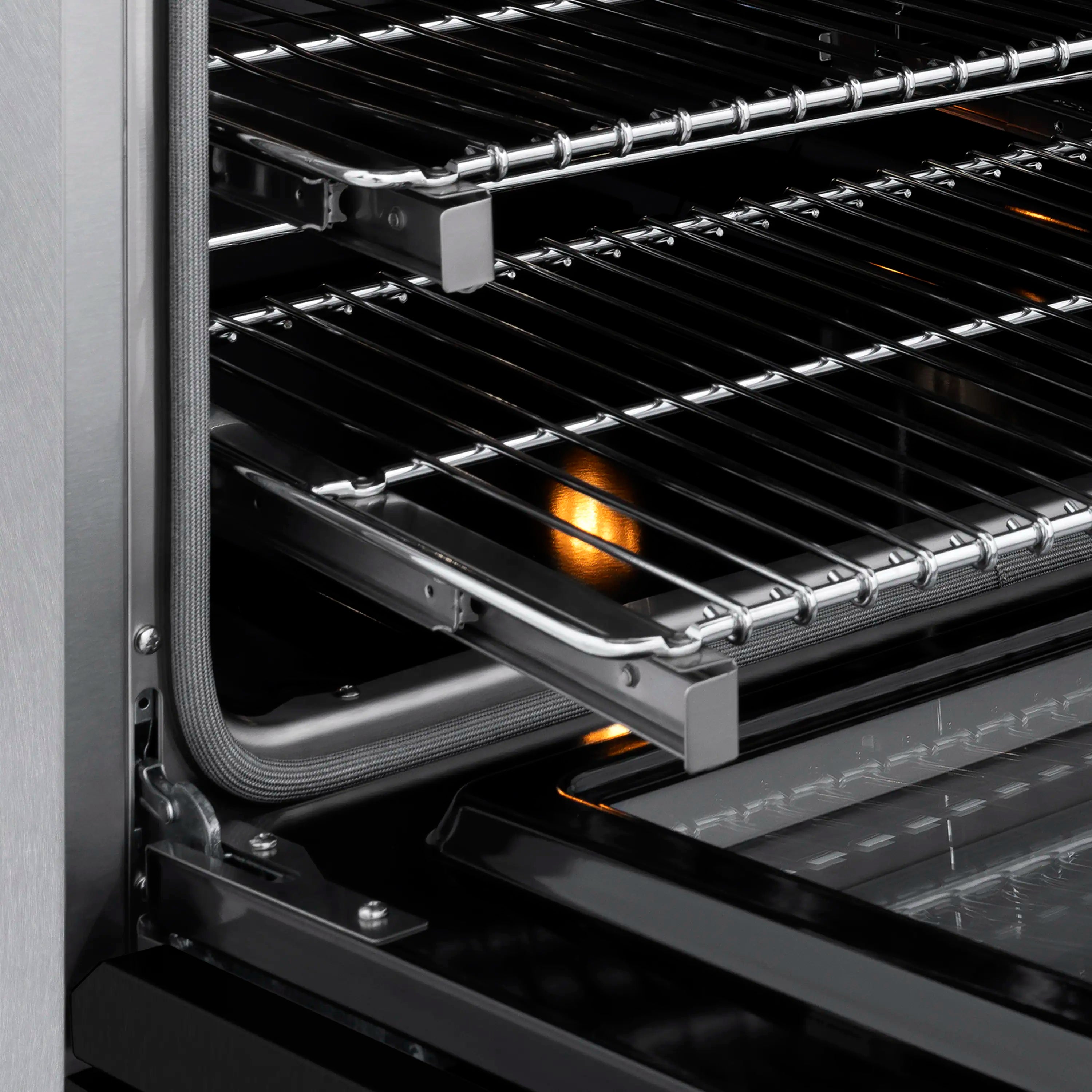 Induction range oven with wire racks and glowing heating element inside