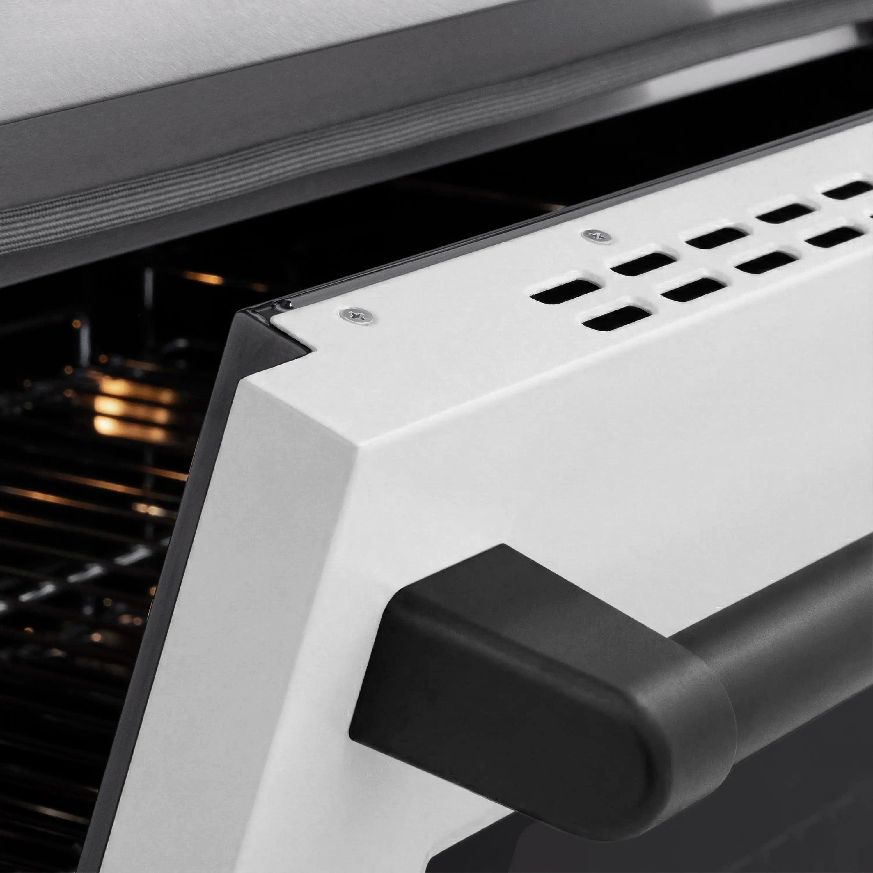 Induction oven door handle and control panel corner in satin stainless steel