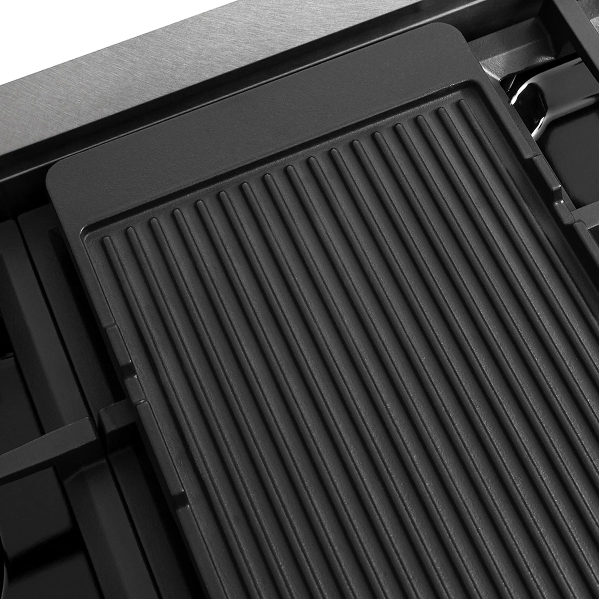 Gas rangetop reversible griddle with ridged black grilling surface
