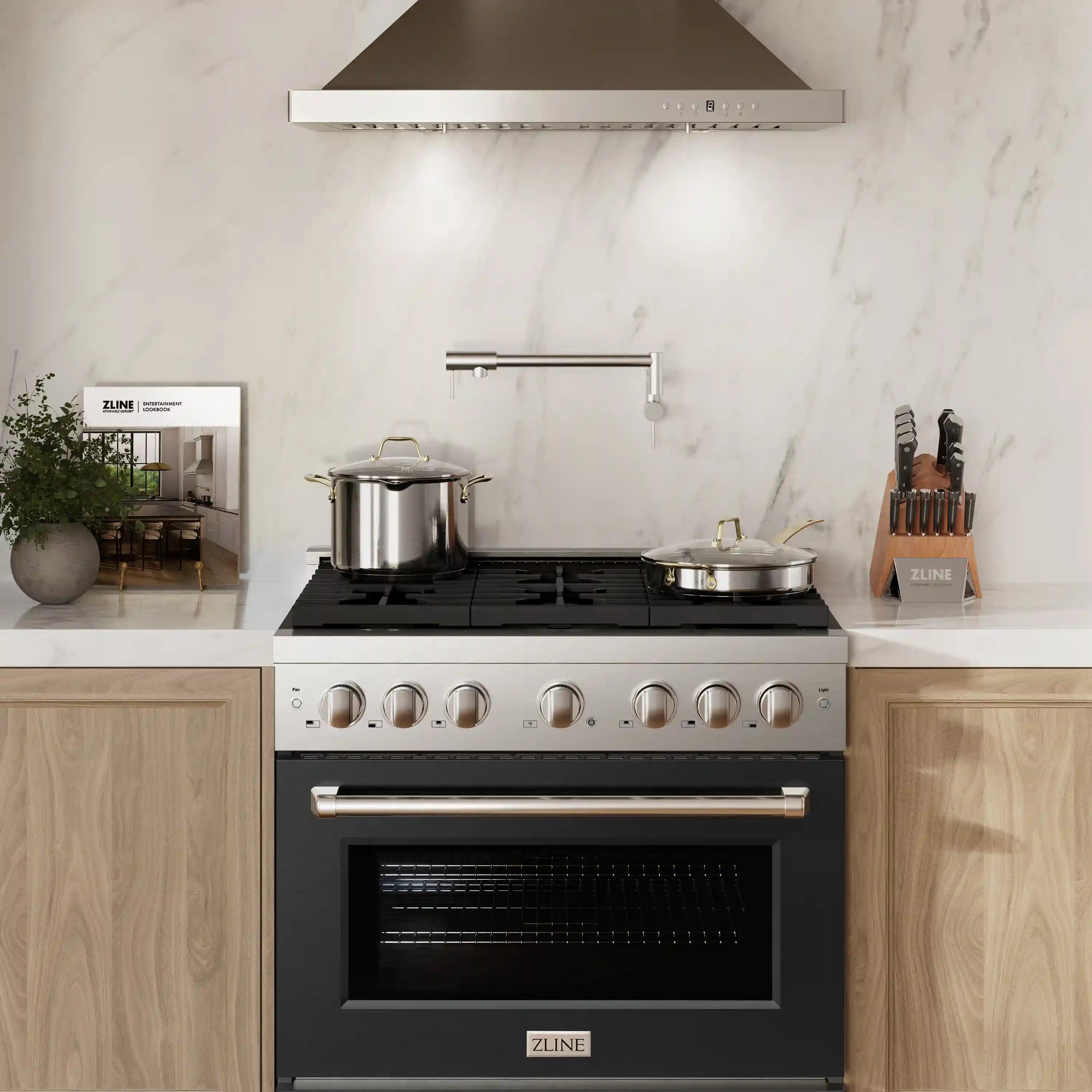 Stainless and black dual fuel range centered in kitchen with cooktop and oven