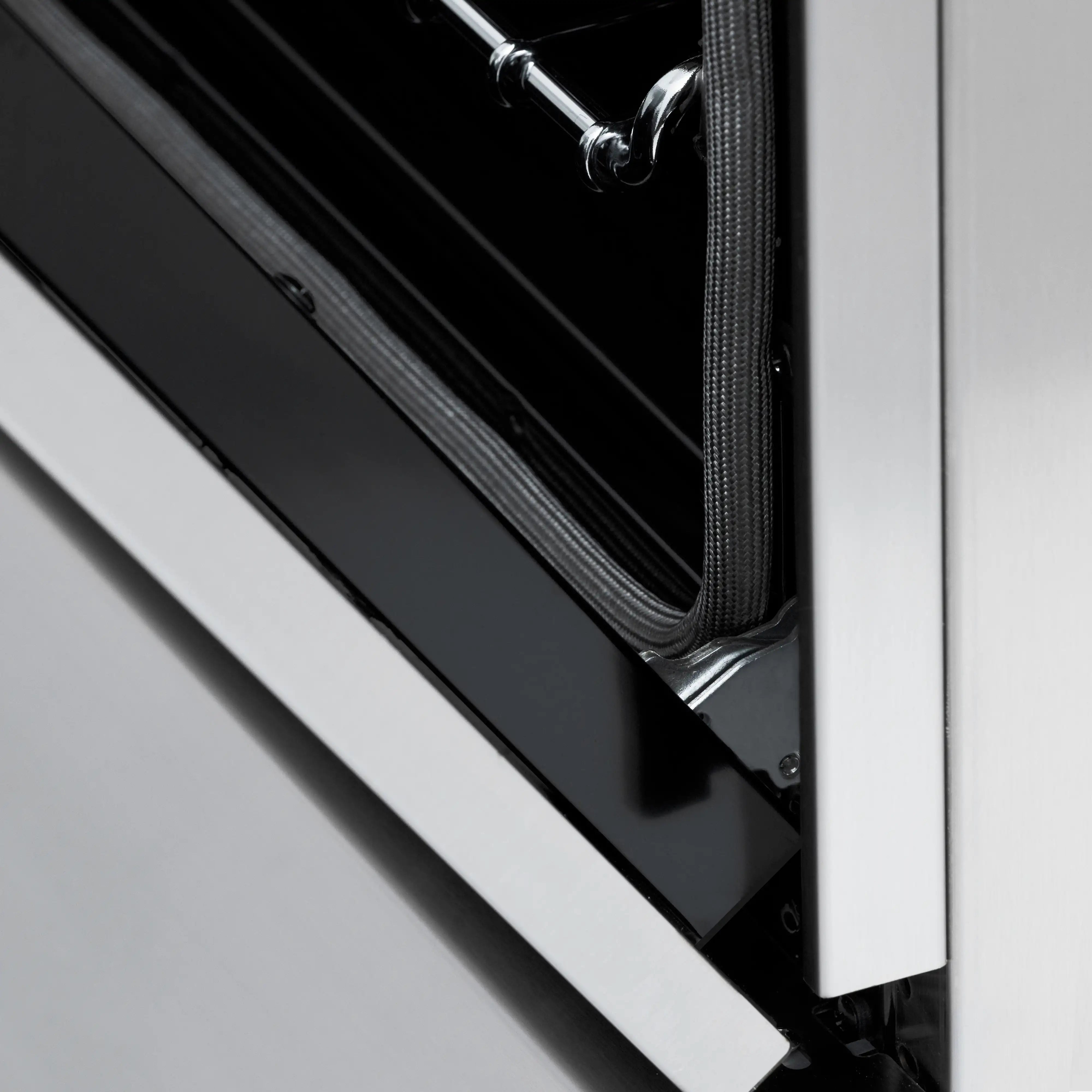 Open oven door with dark glass panel and stainless outer frame