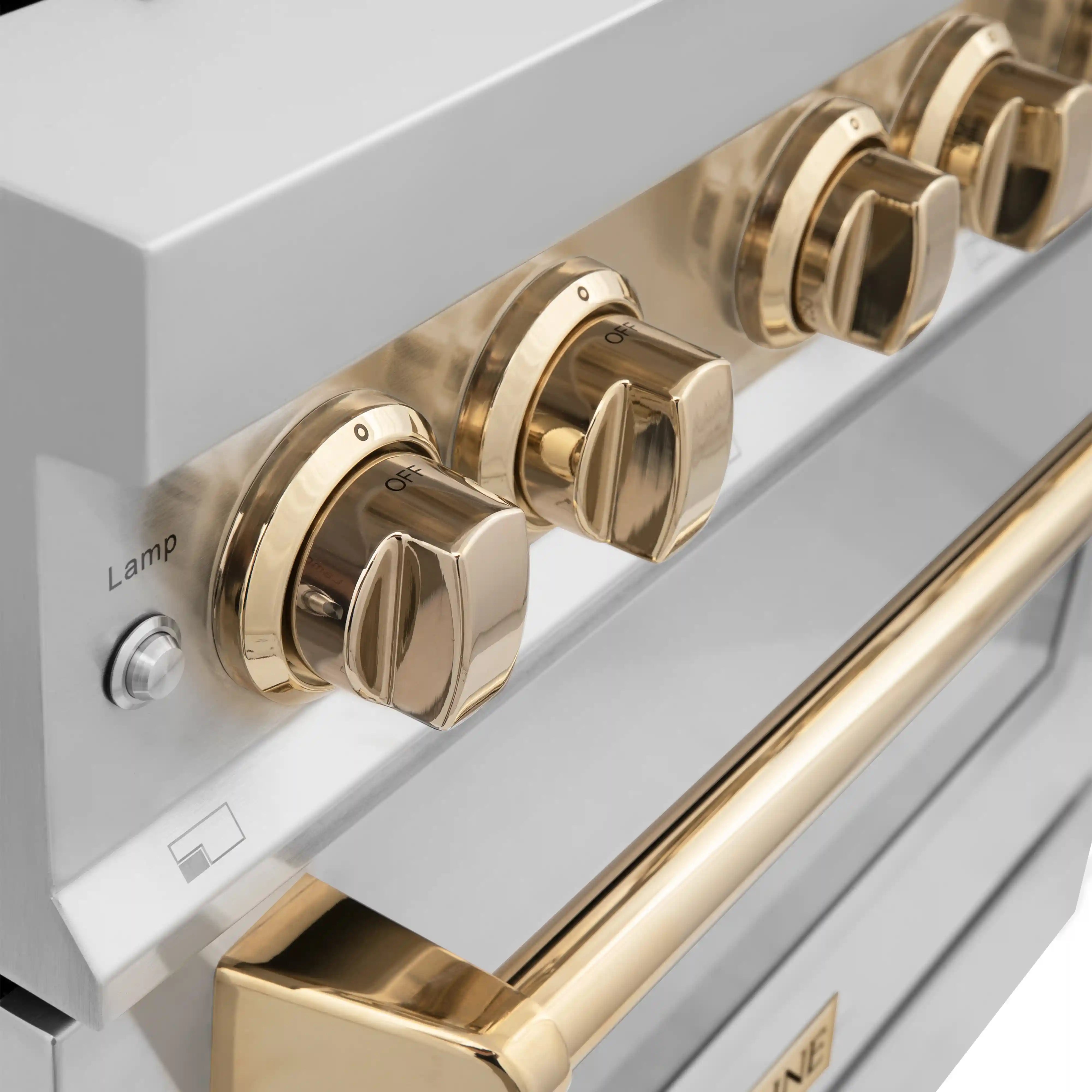 Dual fuel range control panel with gold round knobs and vented metallic trim