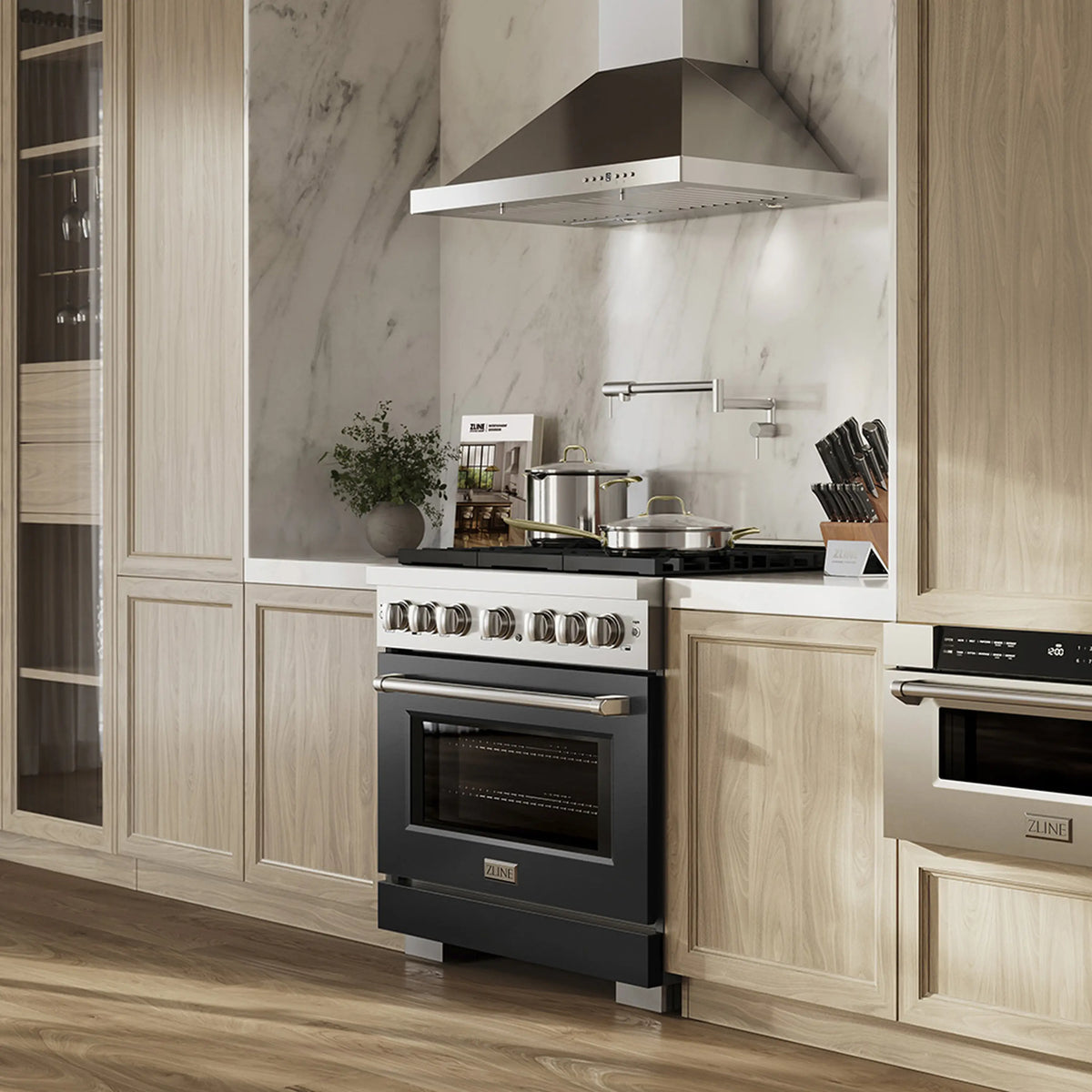 Dual fuel range with black oven door and stainless cooktop controls