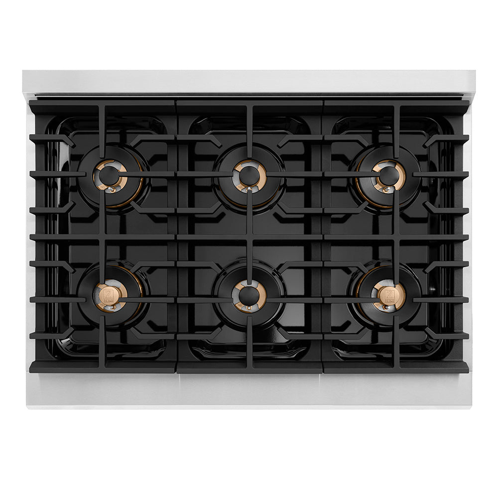 6-burner black cast-iron cooktop on white dual-fuel range, champagne bronze knobs