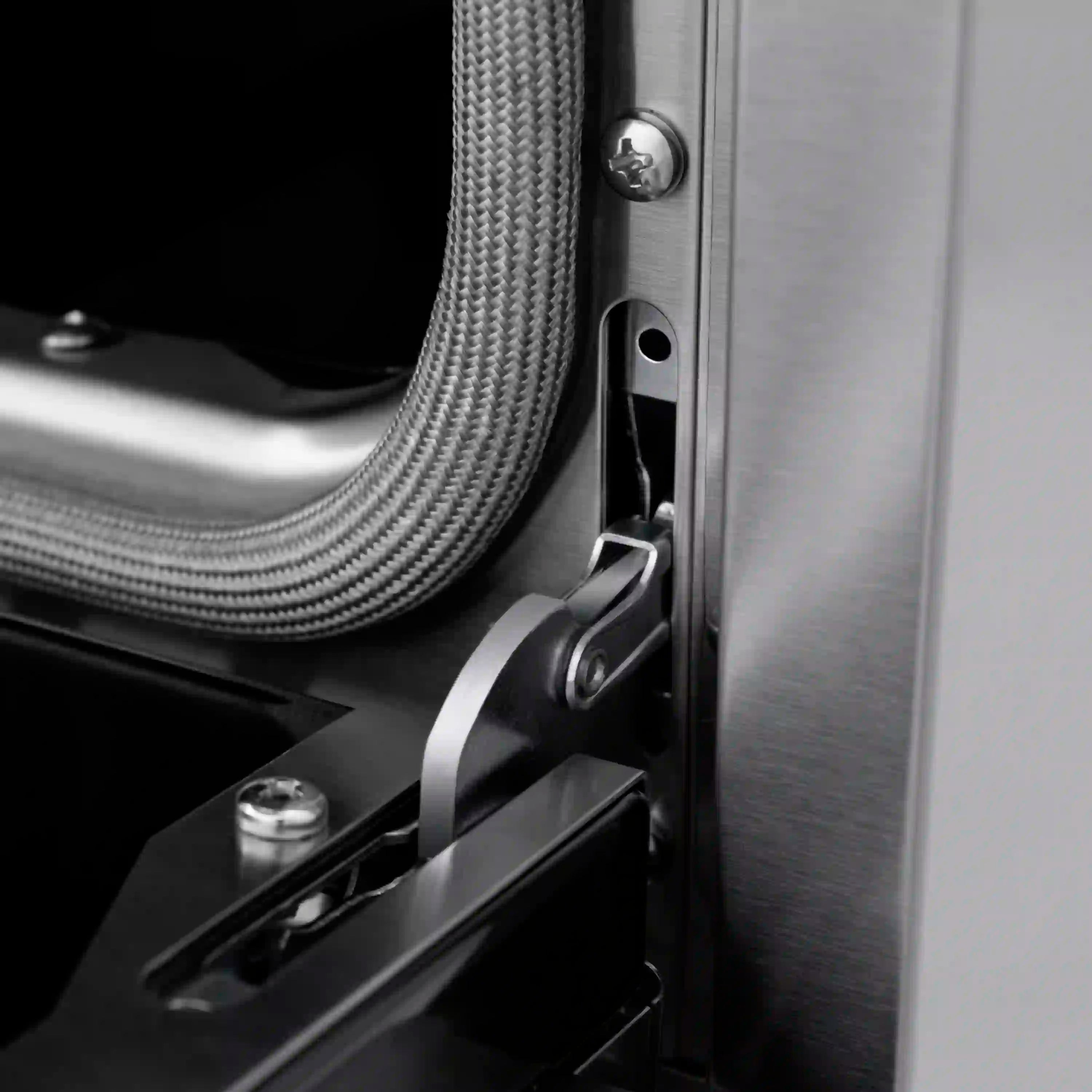 Side connection area on stainless dual fuel range with flexible gas line