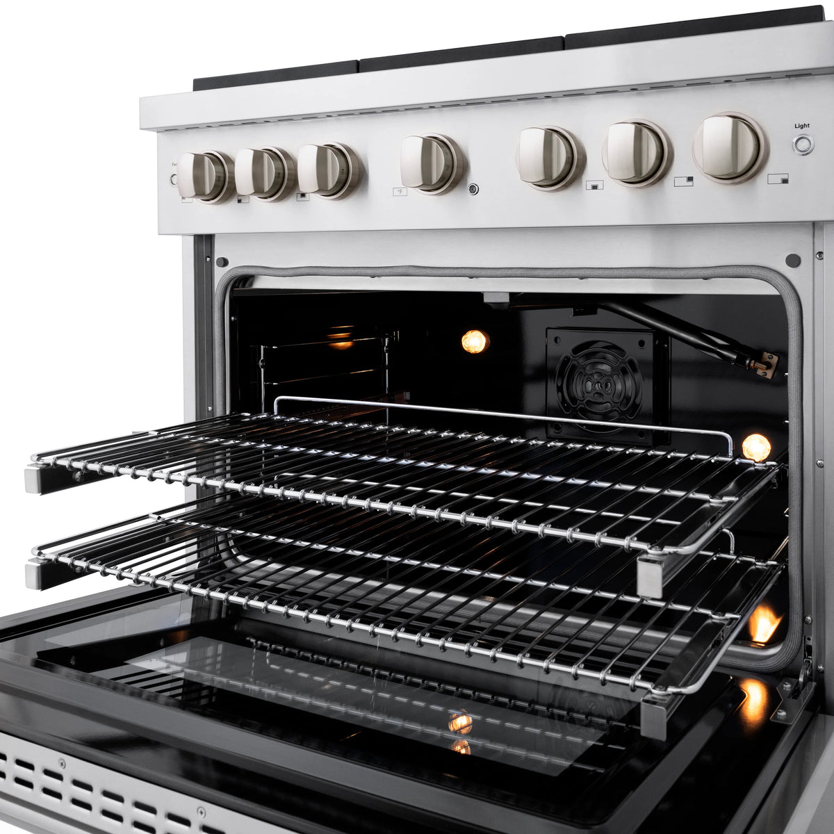 Stainless gas oven door open with racks and glowing burners