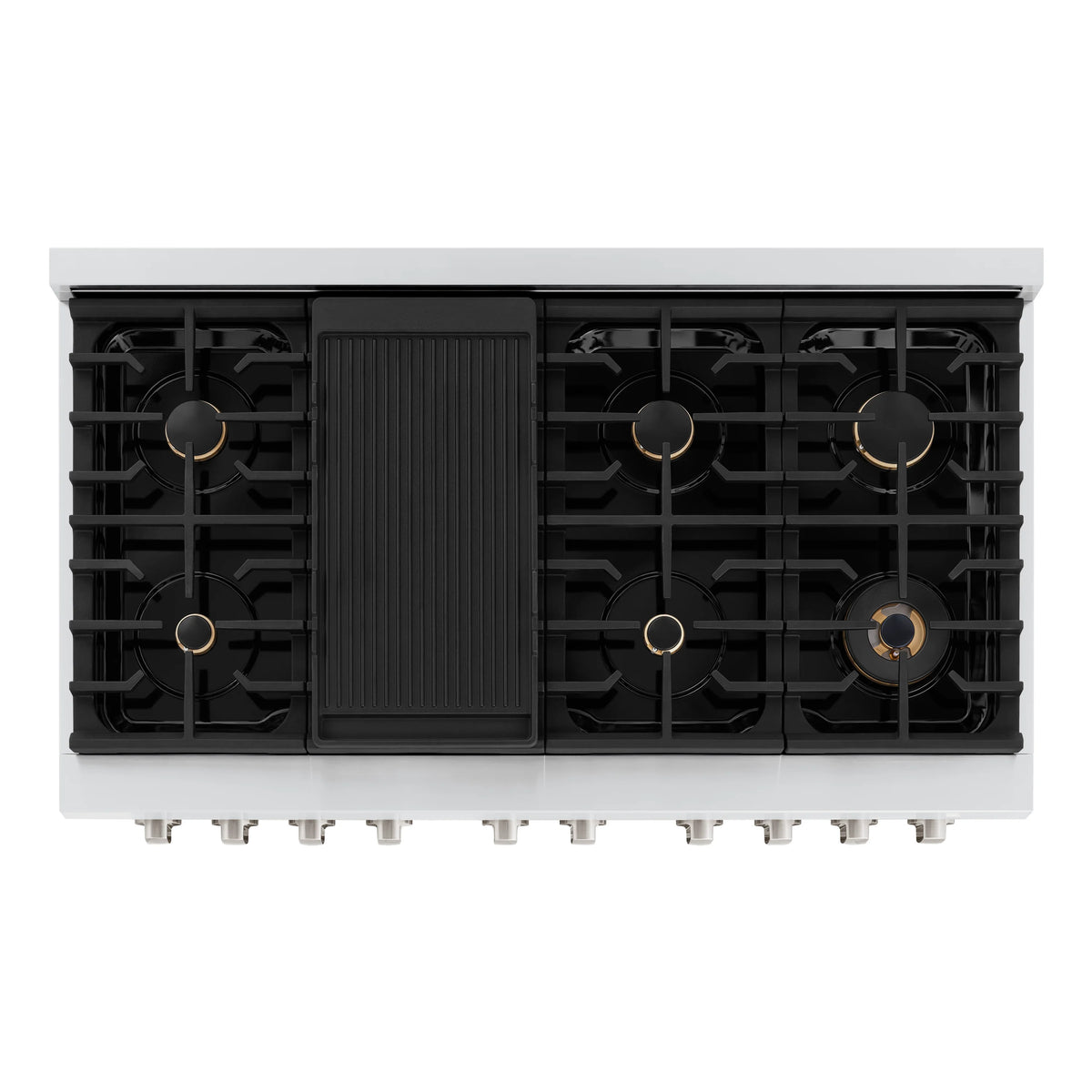 Cooktop burner layout with black grates and brass burner caps on a stainless range
