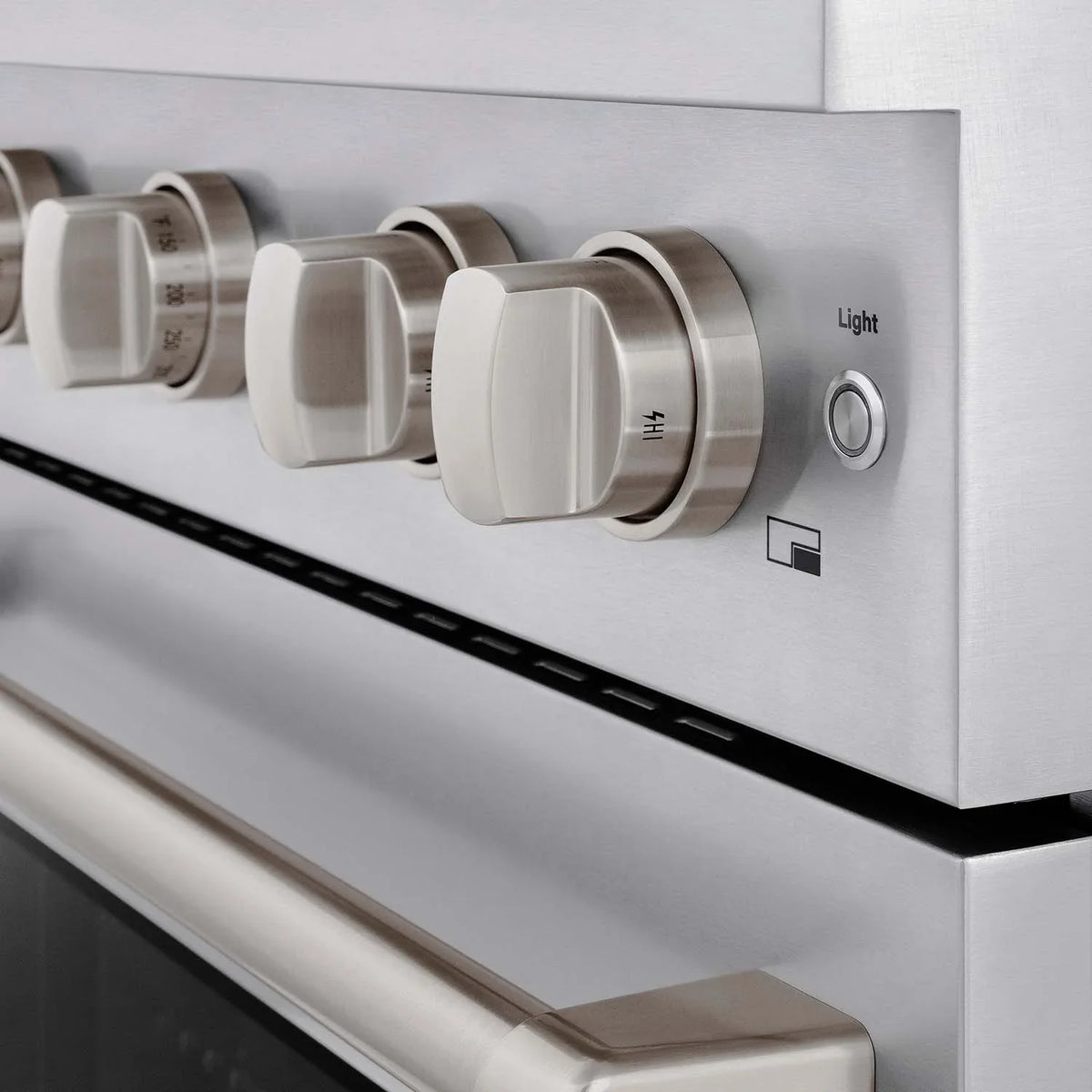 Stainless gas range control panel with round knobs and indicator buttons
