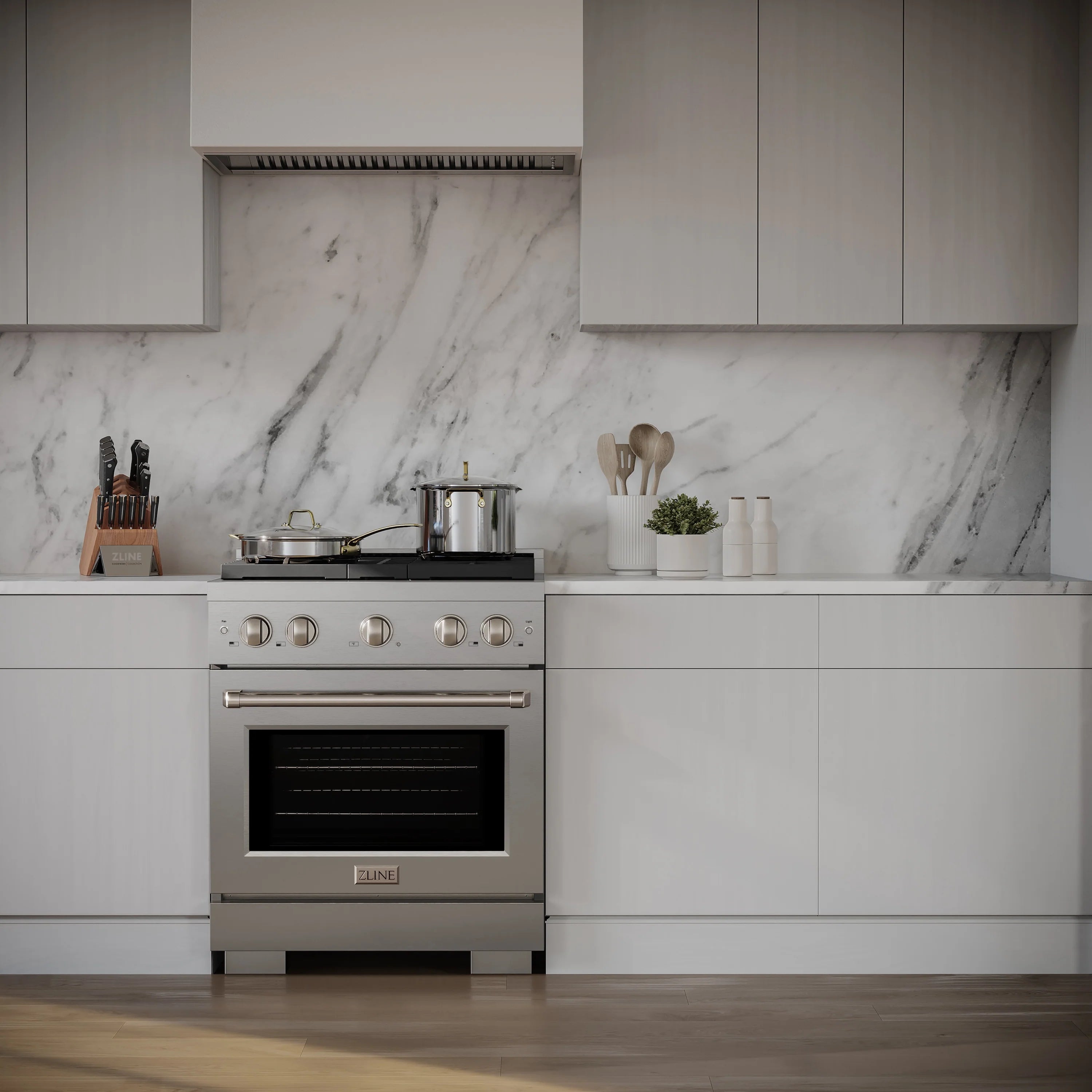 Stainless steel gas range with front control panel and oven door