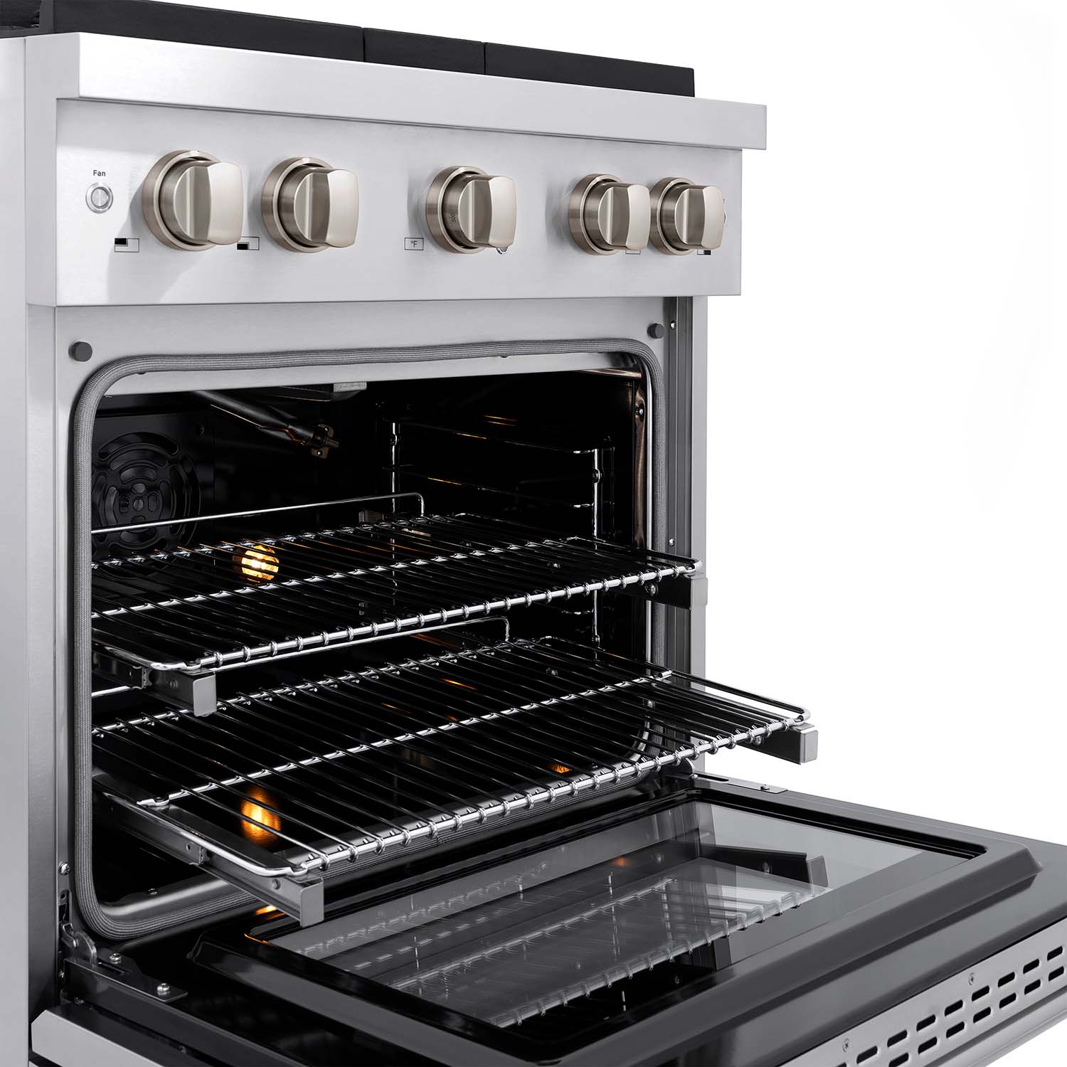 Open gas range oven with metal racks and oven light glow