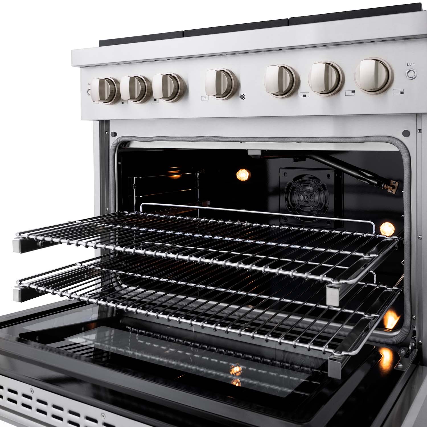 Convection gas oven with multiple oven racks and glowing burners
