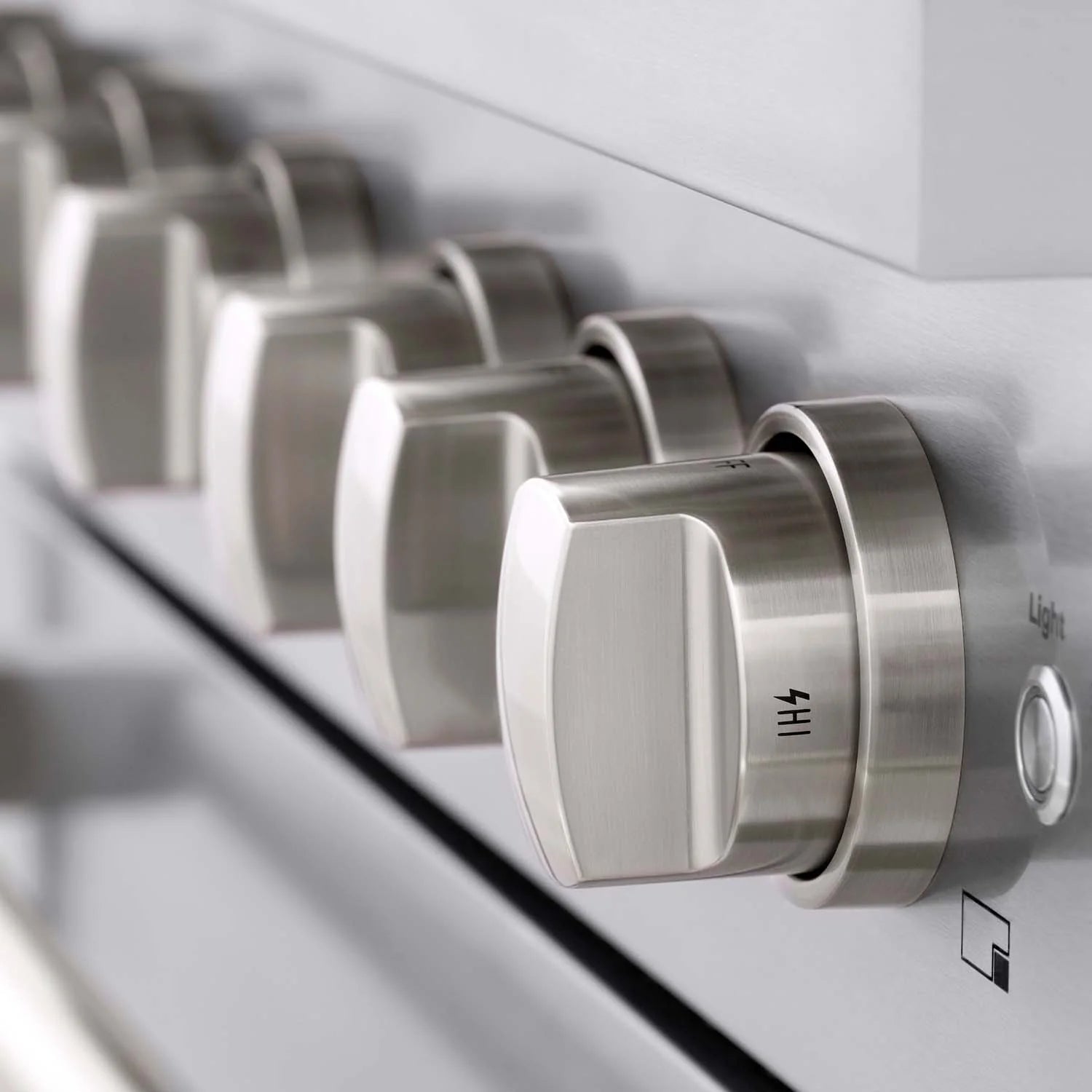 Stainless steel control knob on the range front