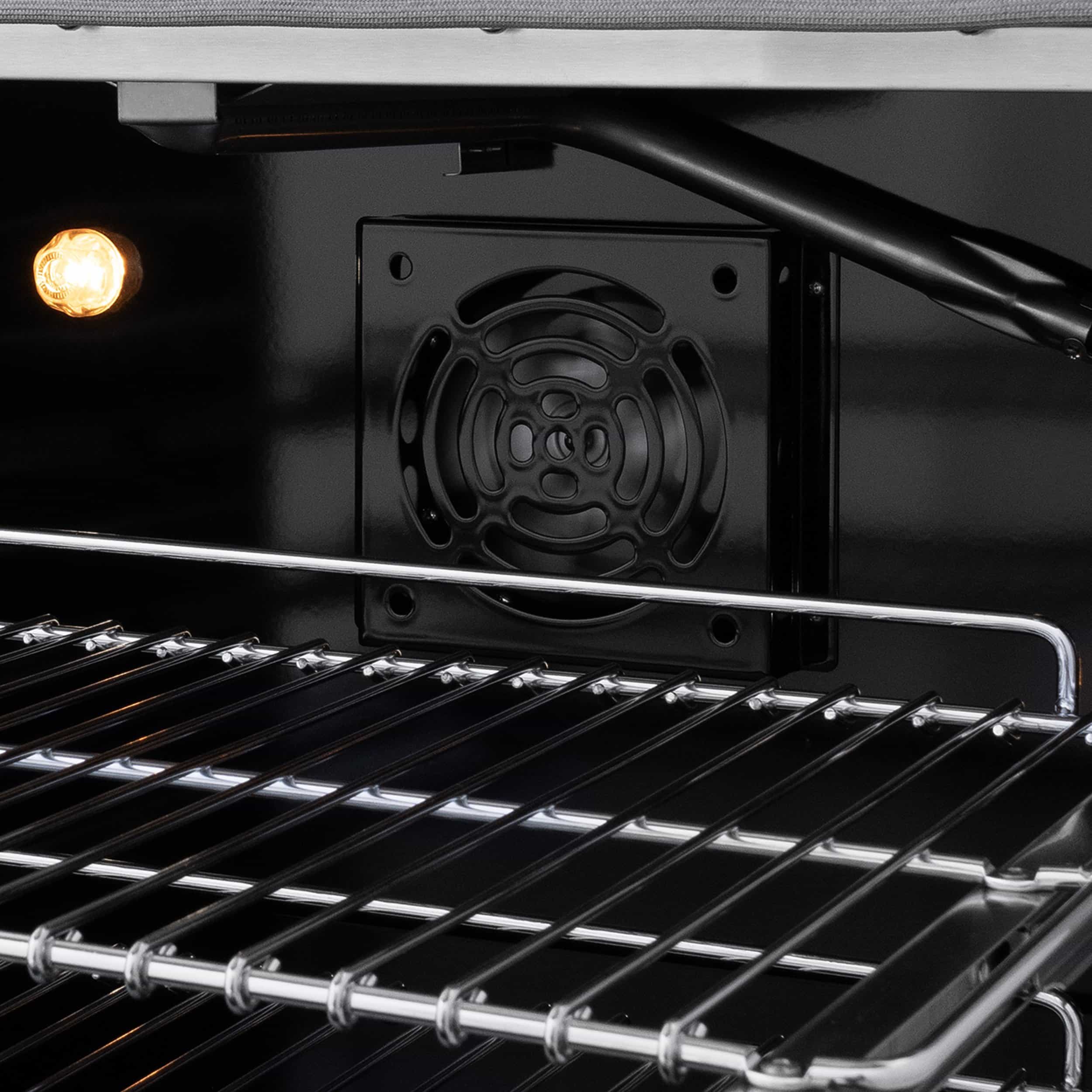 Oven interior fan cover and heating element under cooktop racks