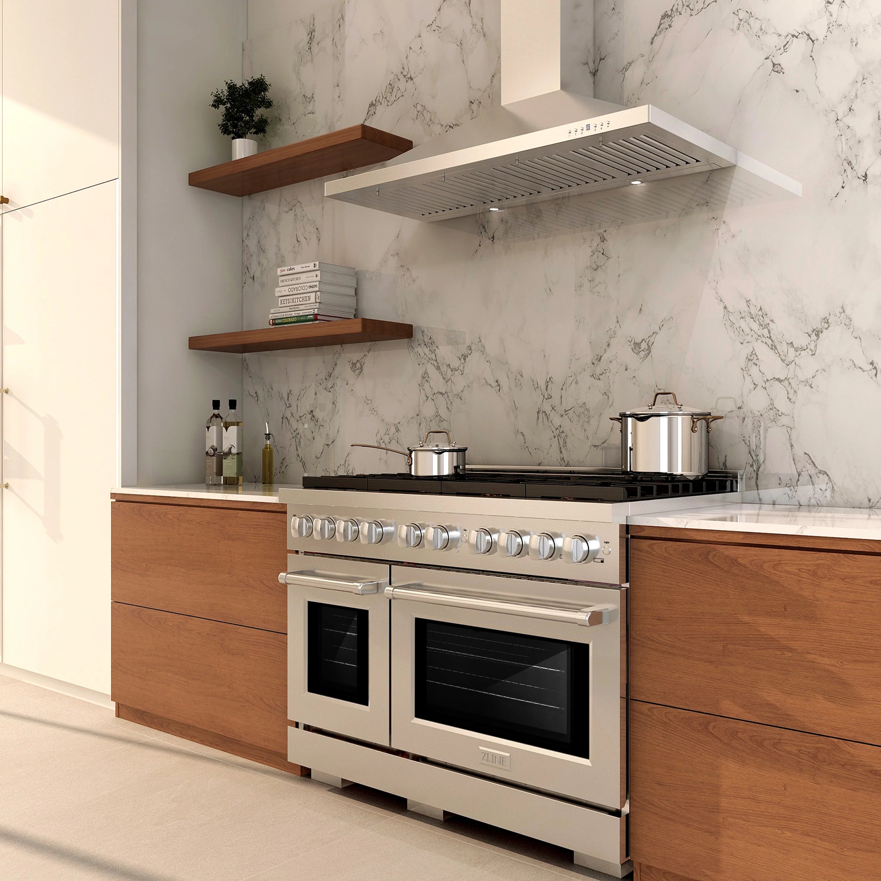 Stainless steel gas range with black cooktop and two oven doors