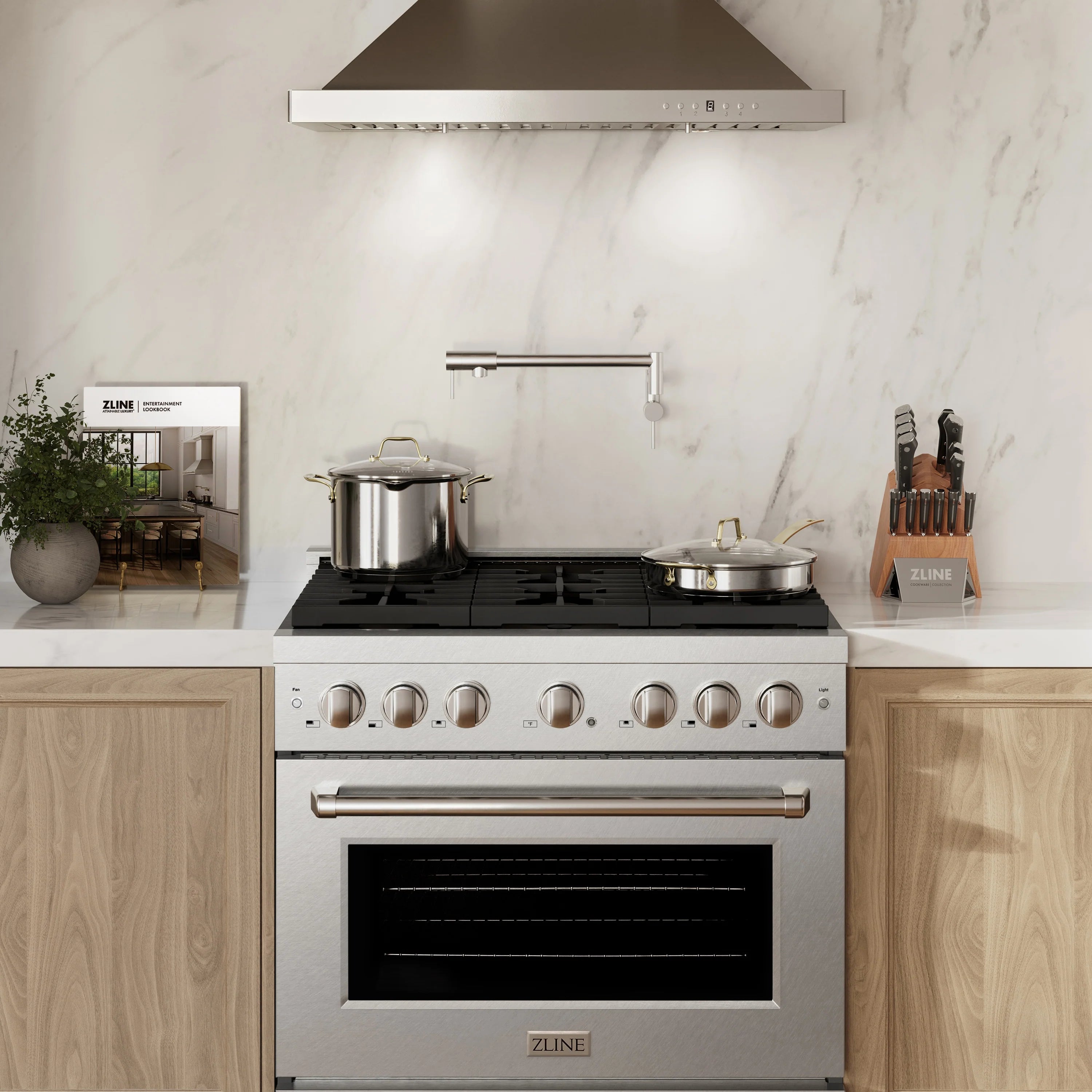 Satin stainless ZLINE gas range with 6 burners, brass knobs, and convection oven door