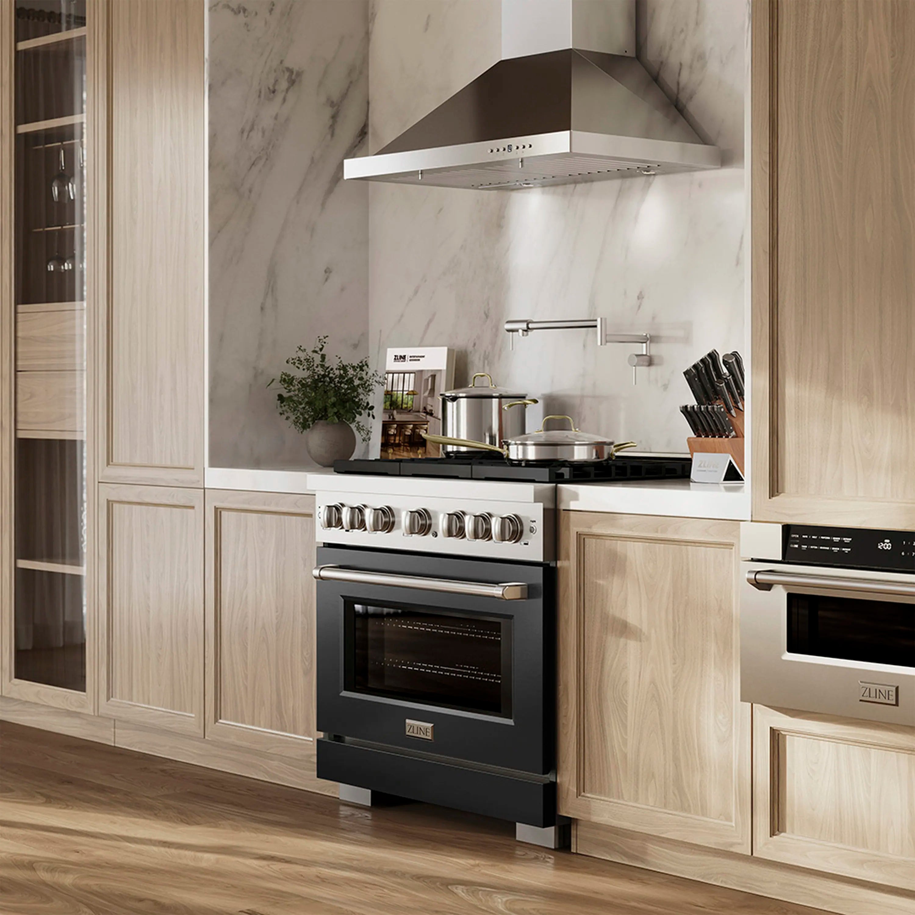 Black gas range with six-burner cooktop and convection oven in a built-in kitchen