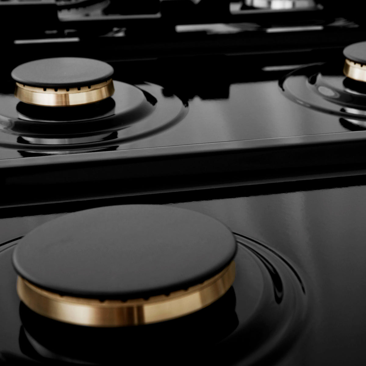 Stainless steel gas rangetop burner with brass ring and black burner cap