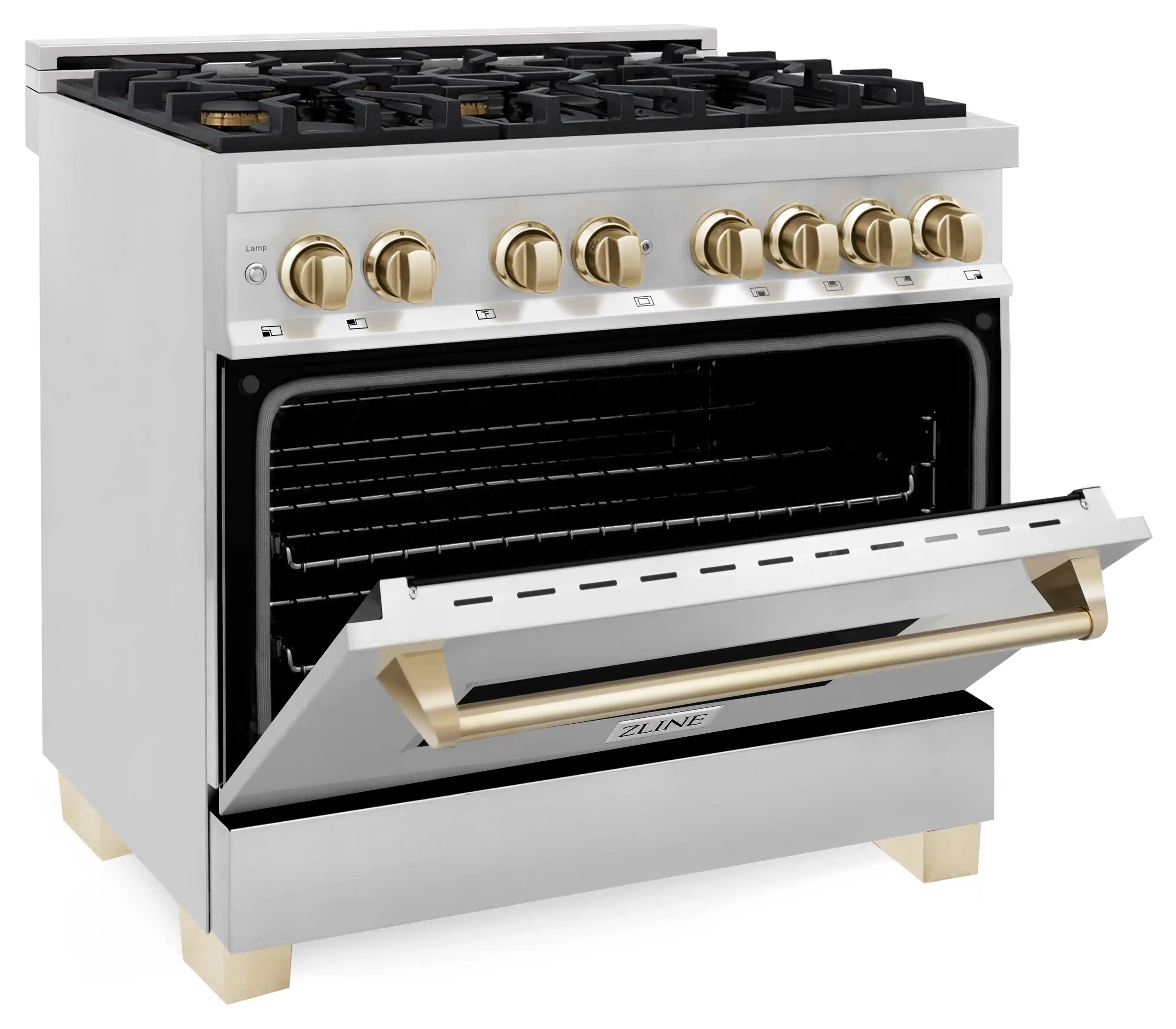 Stainless dual fuel range with open oven cavity and gold handle accents