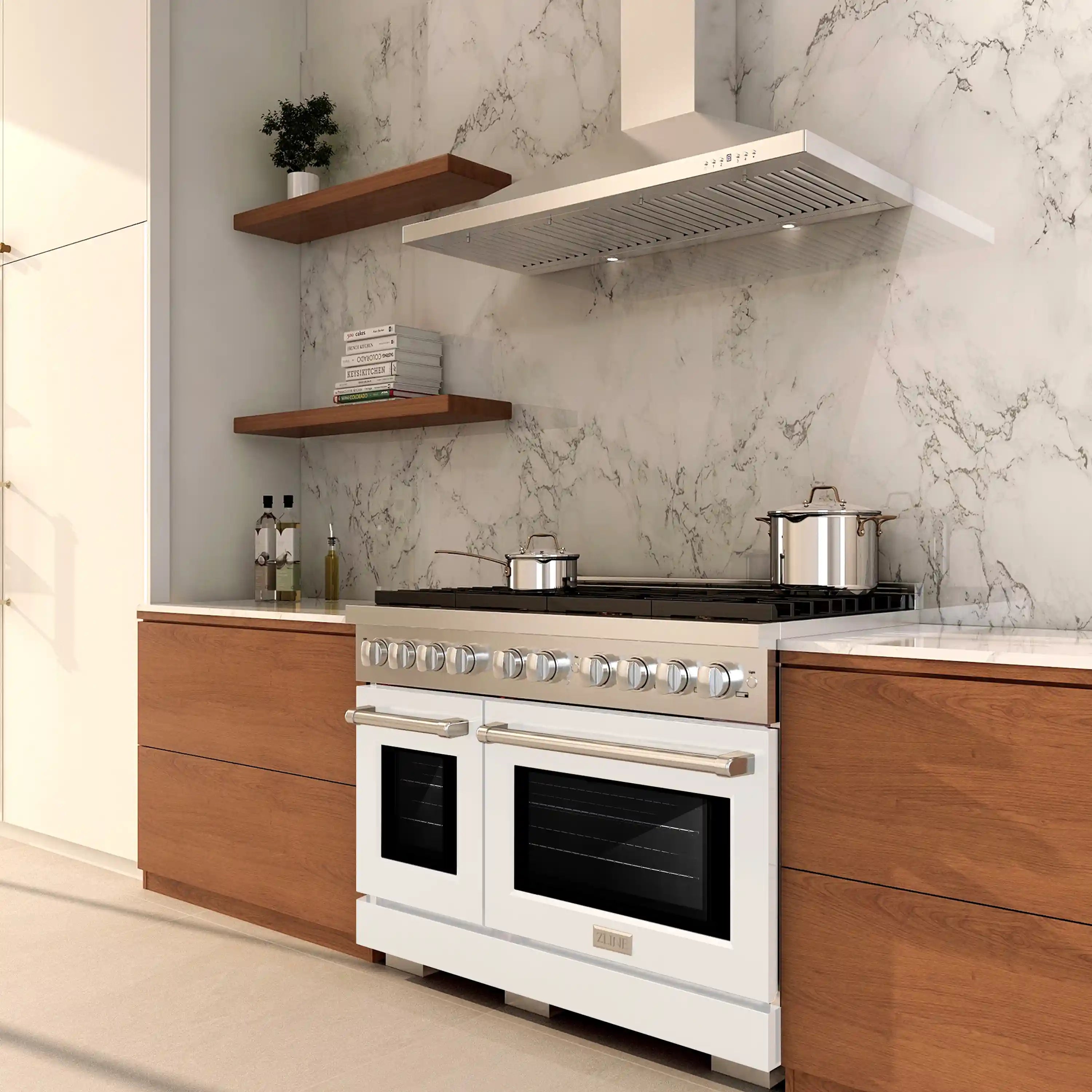 White dual-fuel range with stainless burner knobs and two oven doors