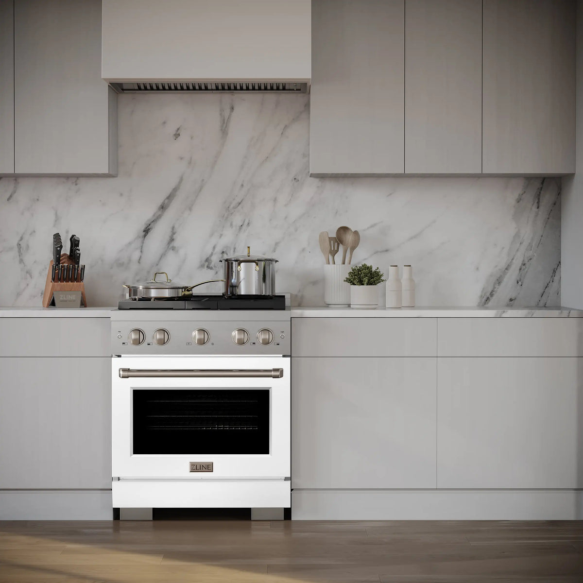 Stainless gas range with white oven door and four-burner cooktop