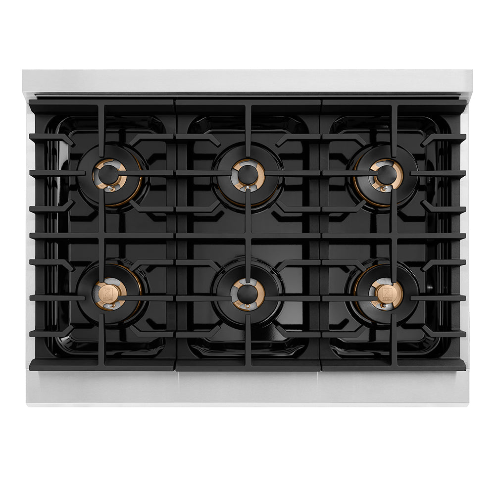 Black gas cooktop with six burners, gold-ring caps, and grates across the surface.