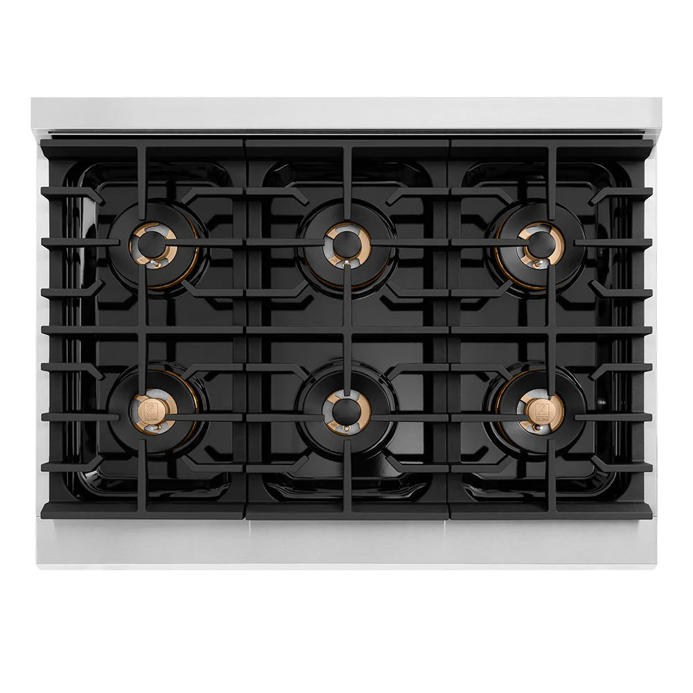 Stainless gas cooktop with six black burners and round brass caps