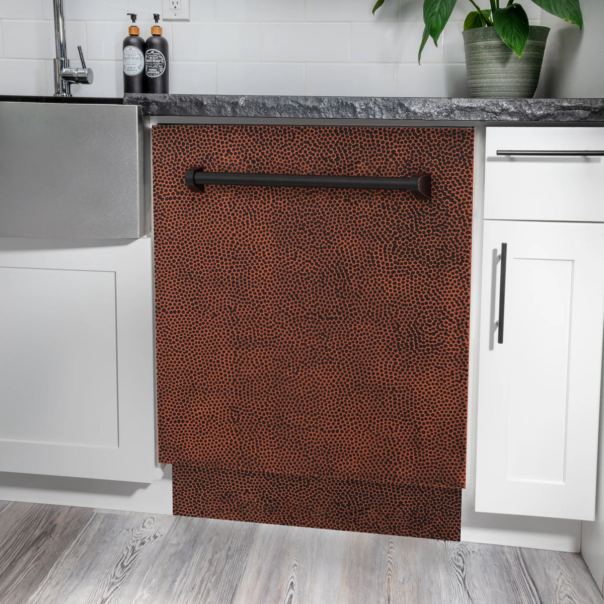 Dishwasher door panel in hand hammered copper with textured finish