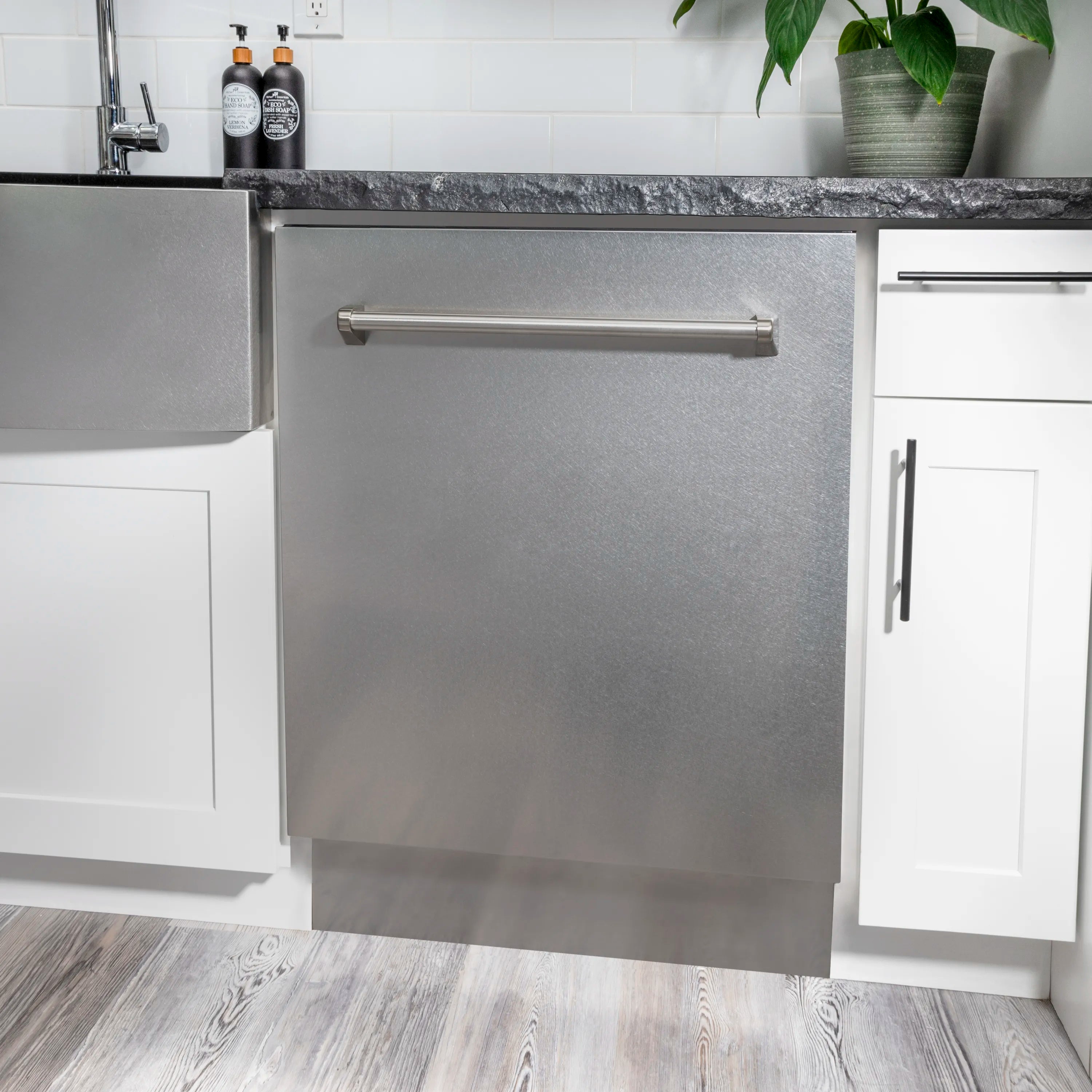 Satin stainless steel dishwasher built-in with front handle and closed door
