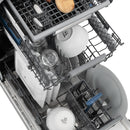 Dishwasher interior with top rack, spray arm, and loading area