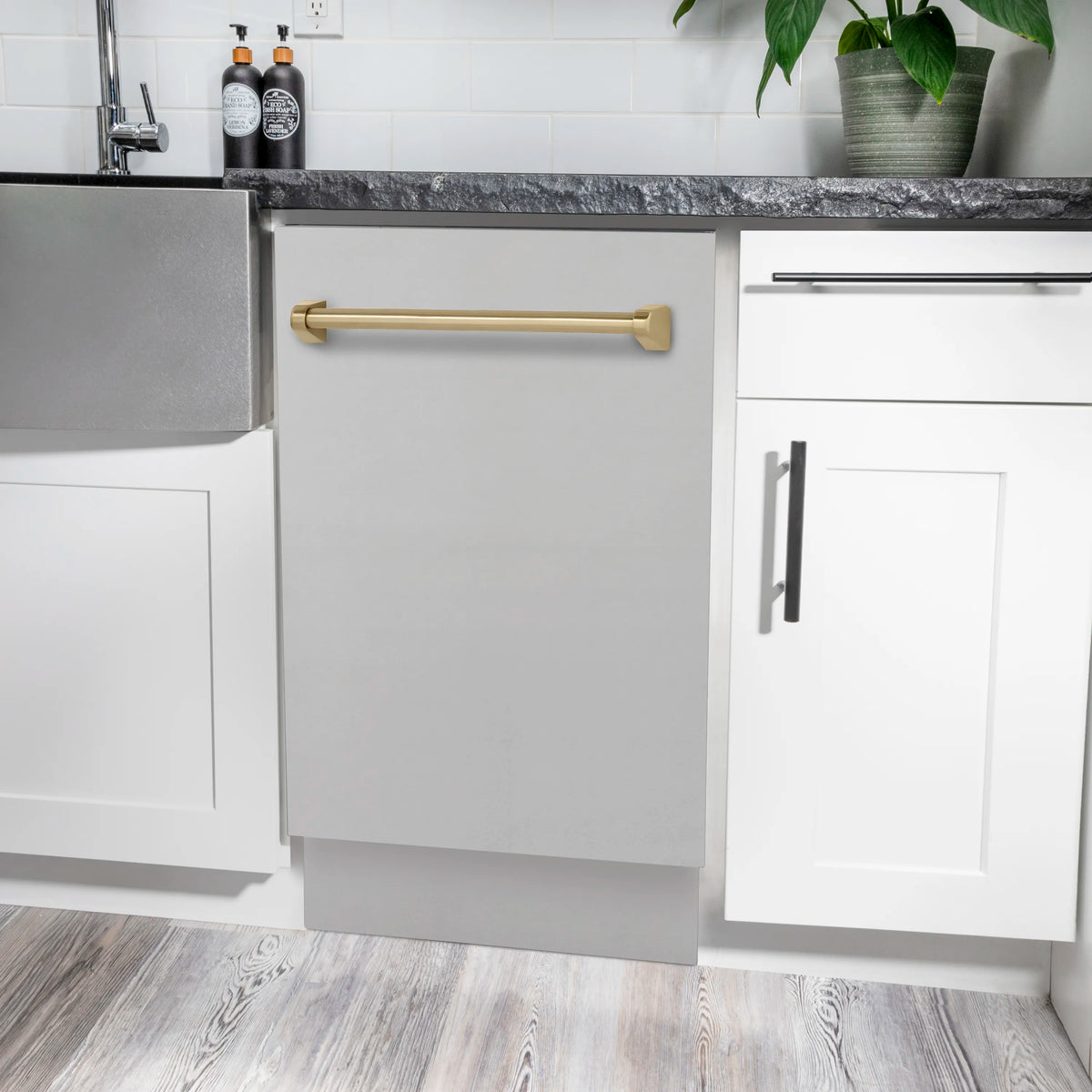 Countertop dishwasher with stainless steel door panel and champagne bronze bar handle