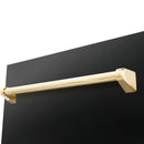 Polished gold bar dishwasher handle on a black door, close-up