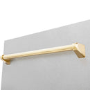 Satin stainless dishwasher door with gold bar handle close-up.