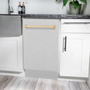 Compact dishwasher with satin stainless door and gold handle, door open.