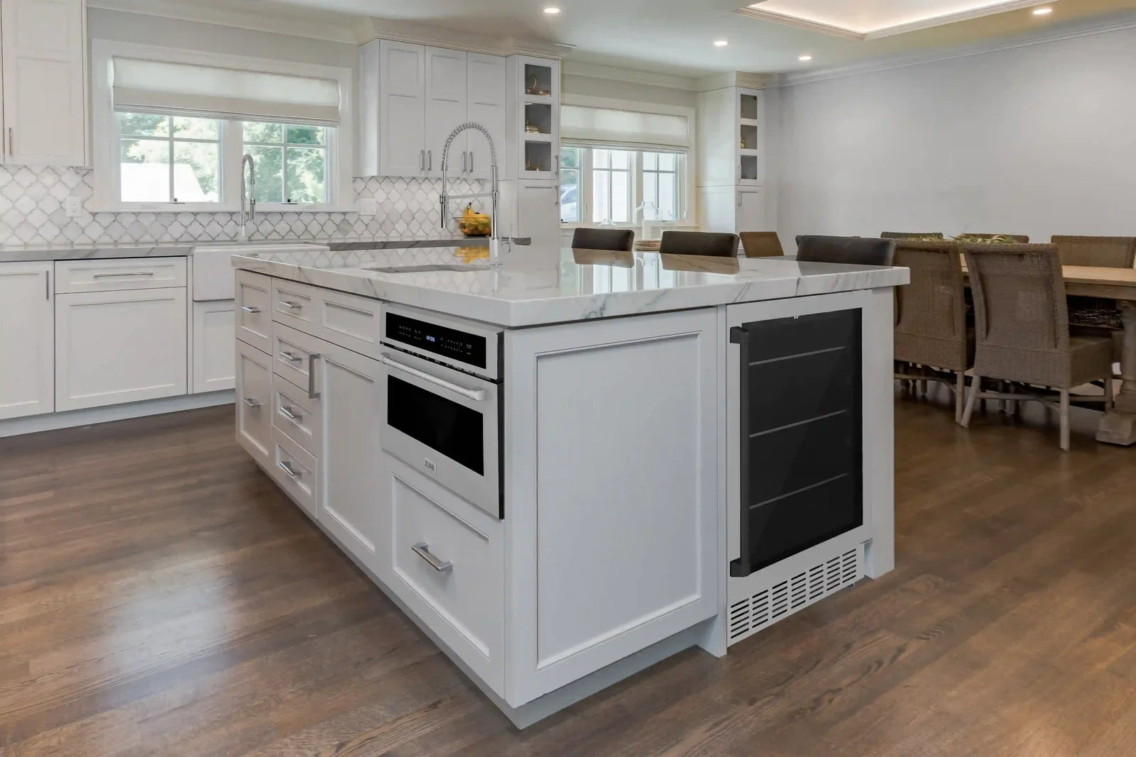 Stainless under-counter beverage fridge with glass door and matte black trim