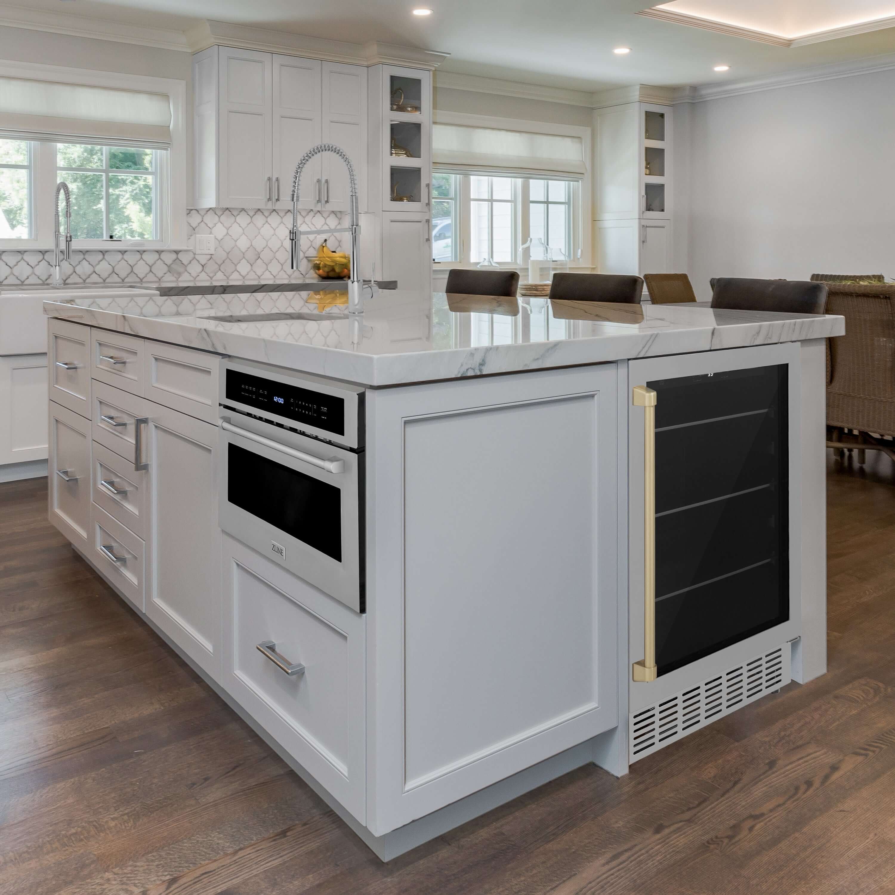 Stainless beverage fridge with black glass door and champagne bronze handle in kitchen